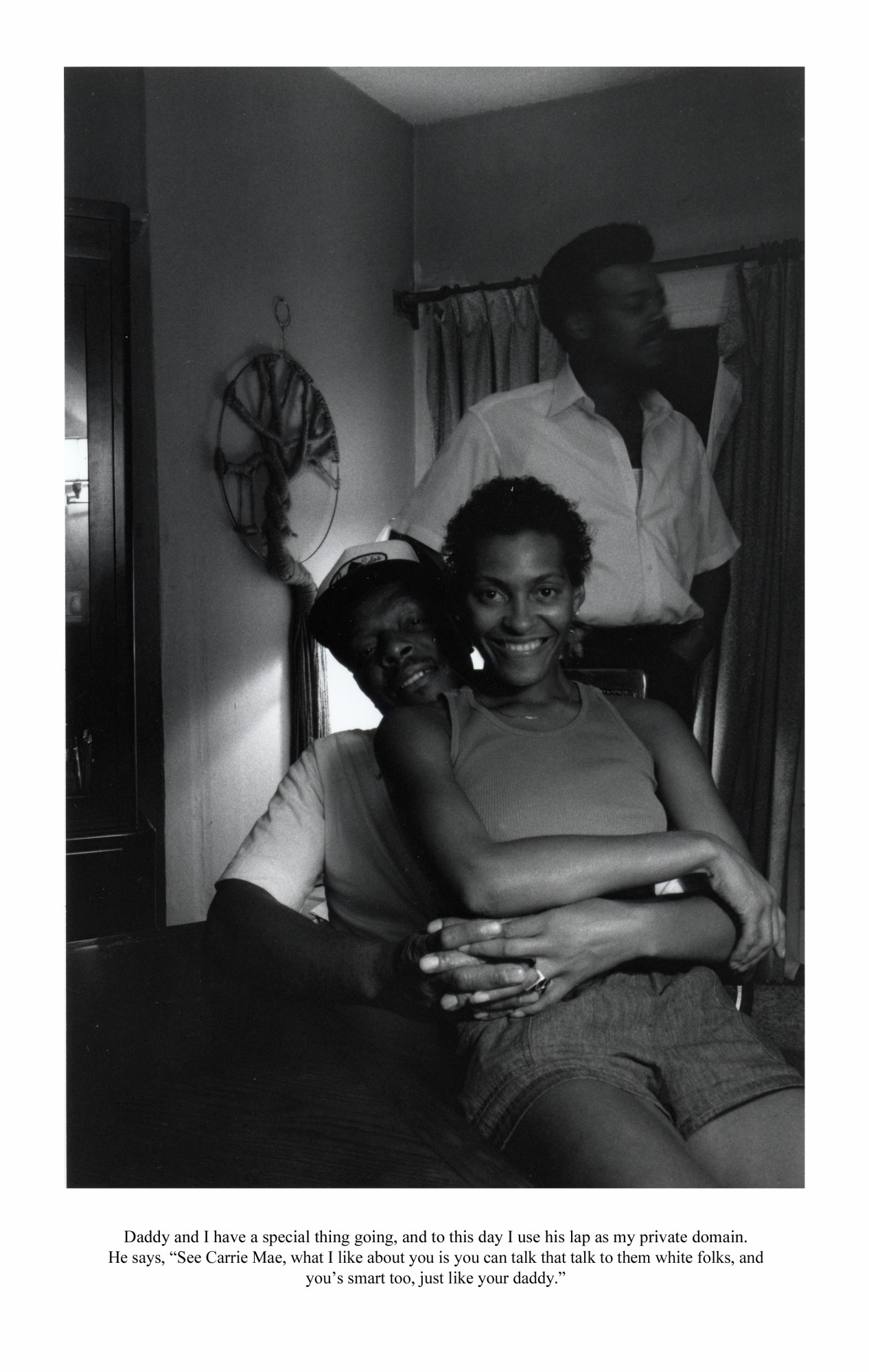 Carrie Mae Weems sitting in her father's lap