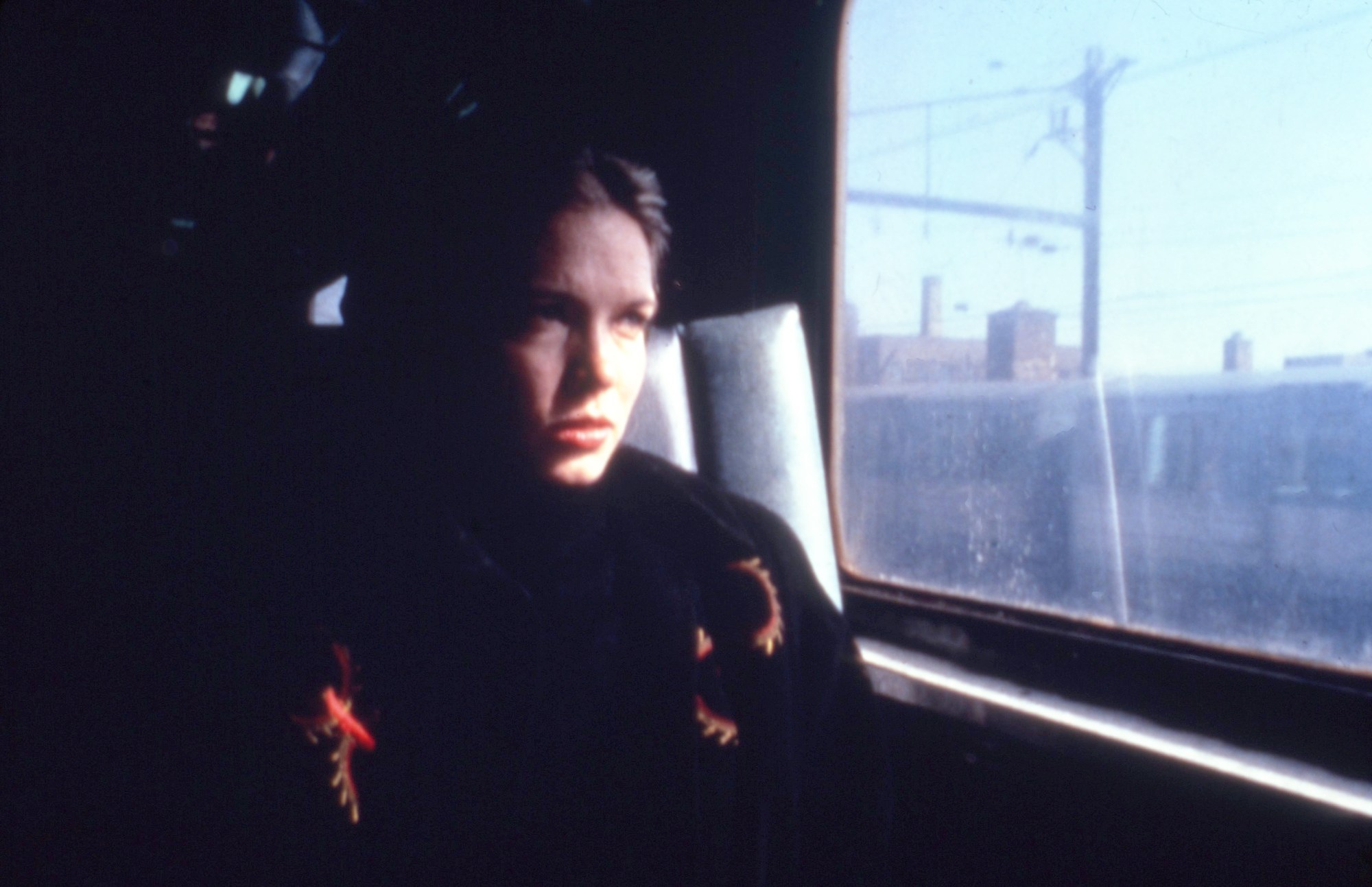 Sandy McLeod as Christine in Variety, sitting on a dark train