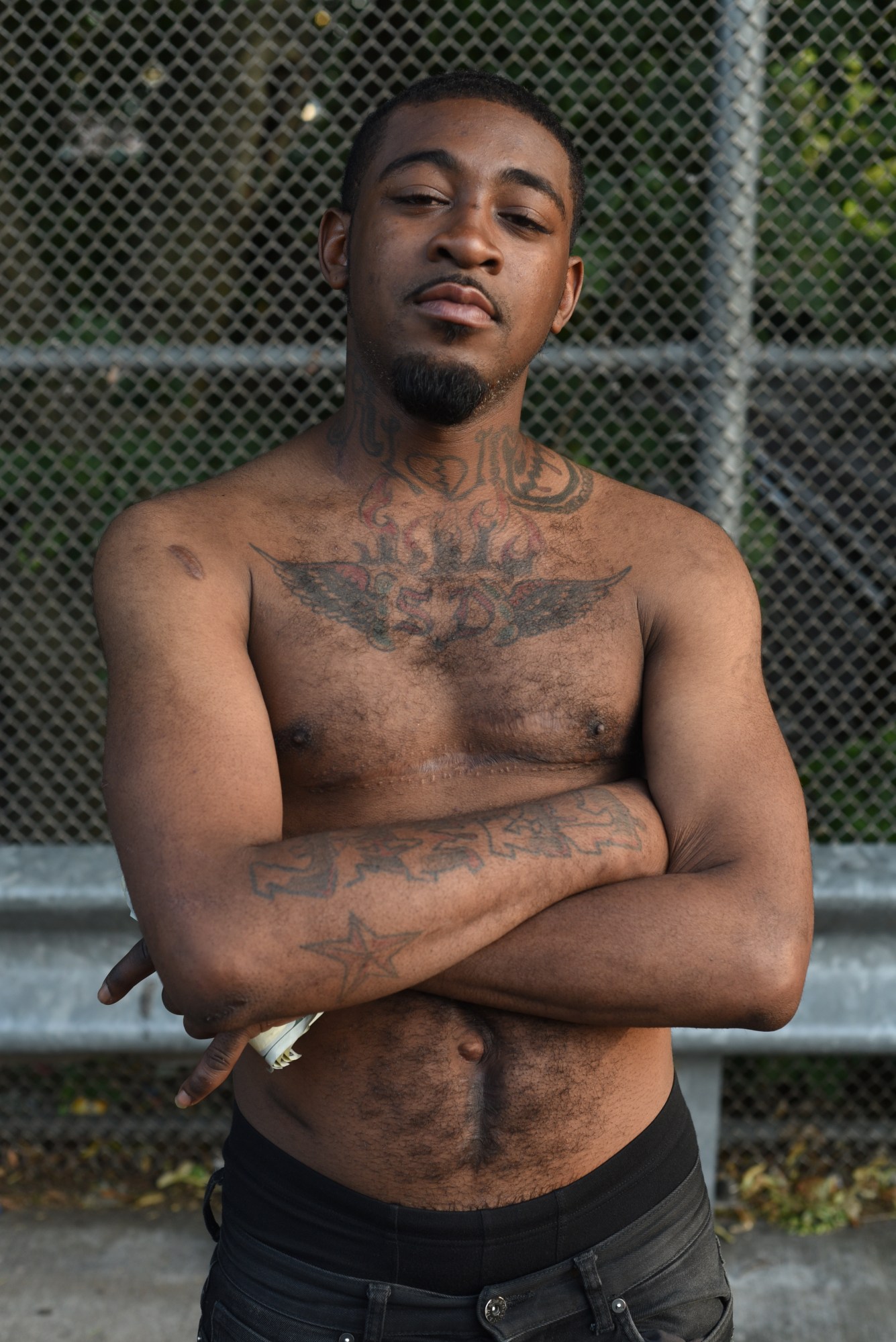 Photograph from End of the Line by Taylor Chapman of a shirtless trans man