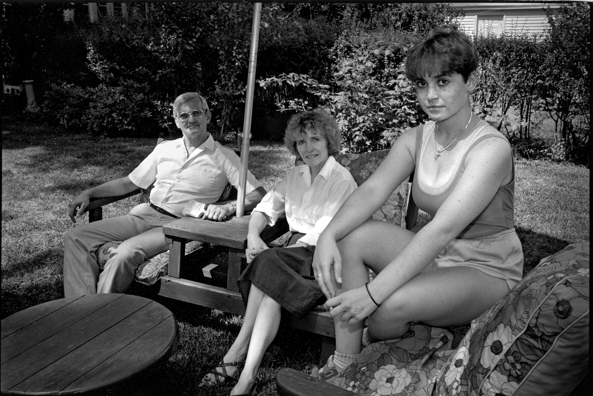 maura and her parents lounging outside in long island by joseph szabo