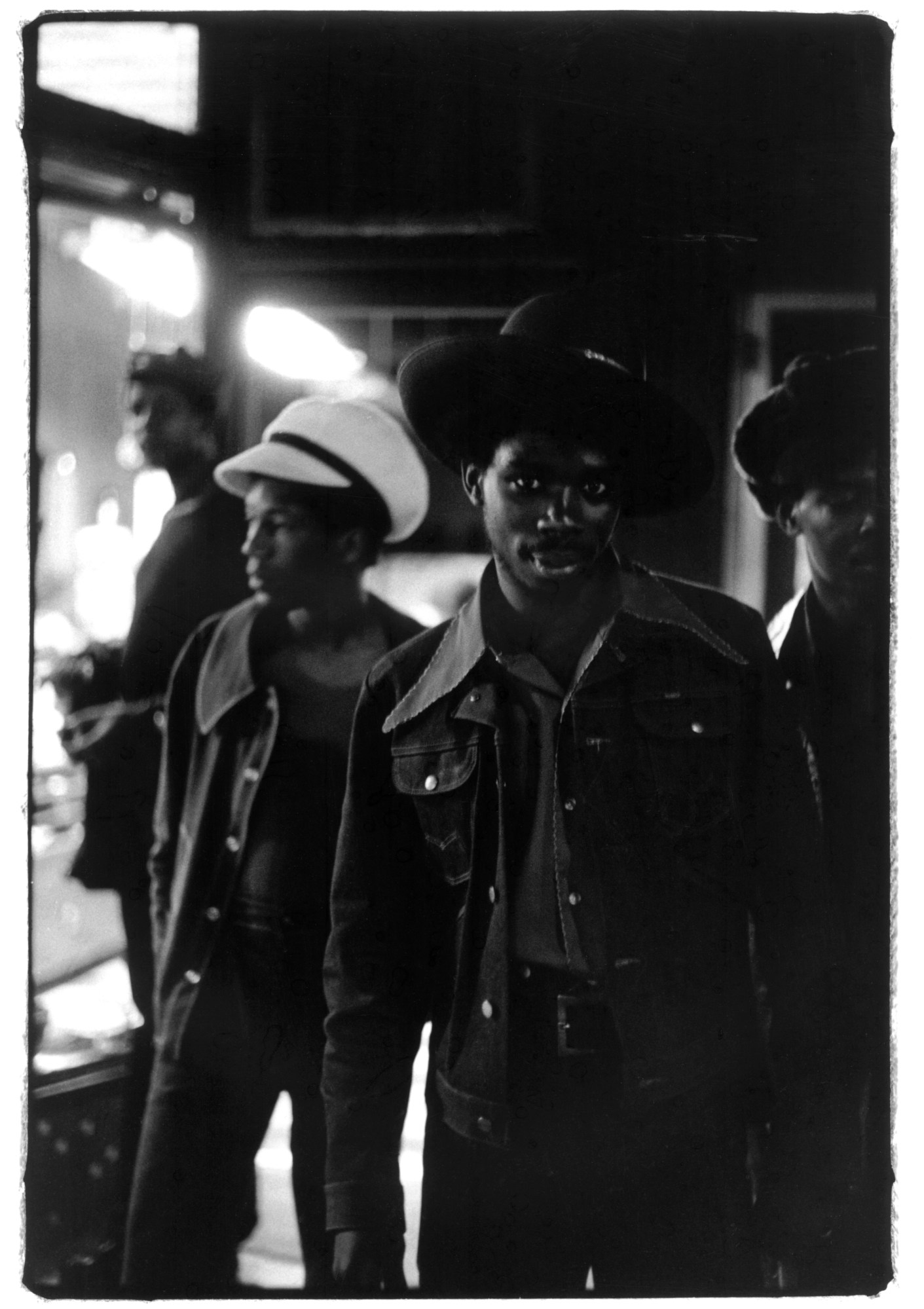 black and white photo of three men in cowboy gear