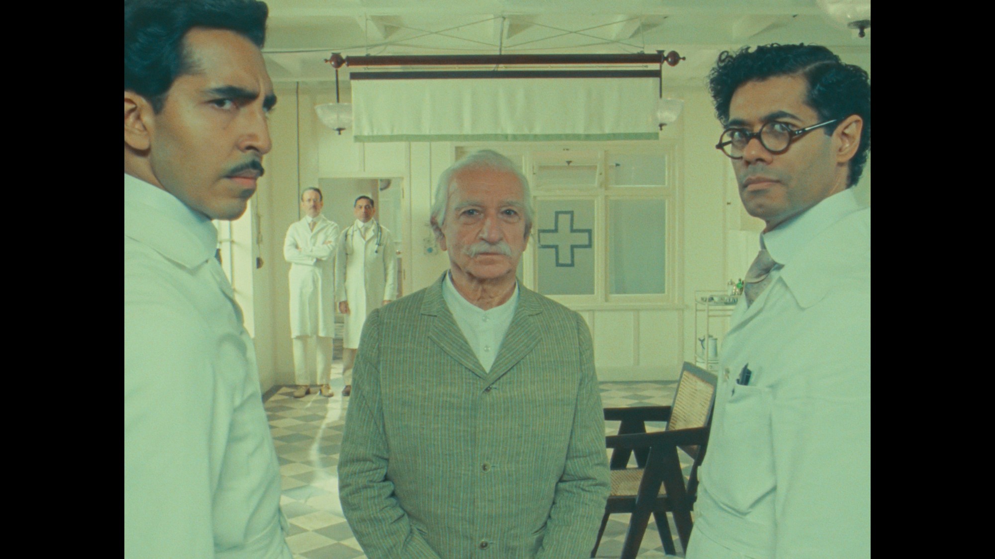 dev patel, sir ben kingsley and richard ayoade in a scene from the wonderful story of henry sugar