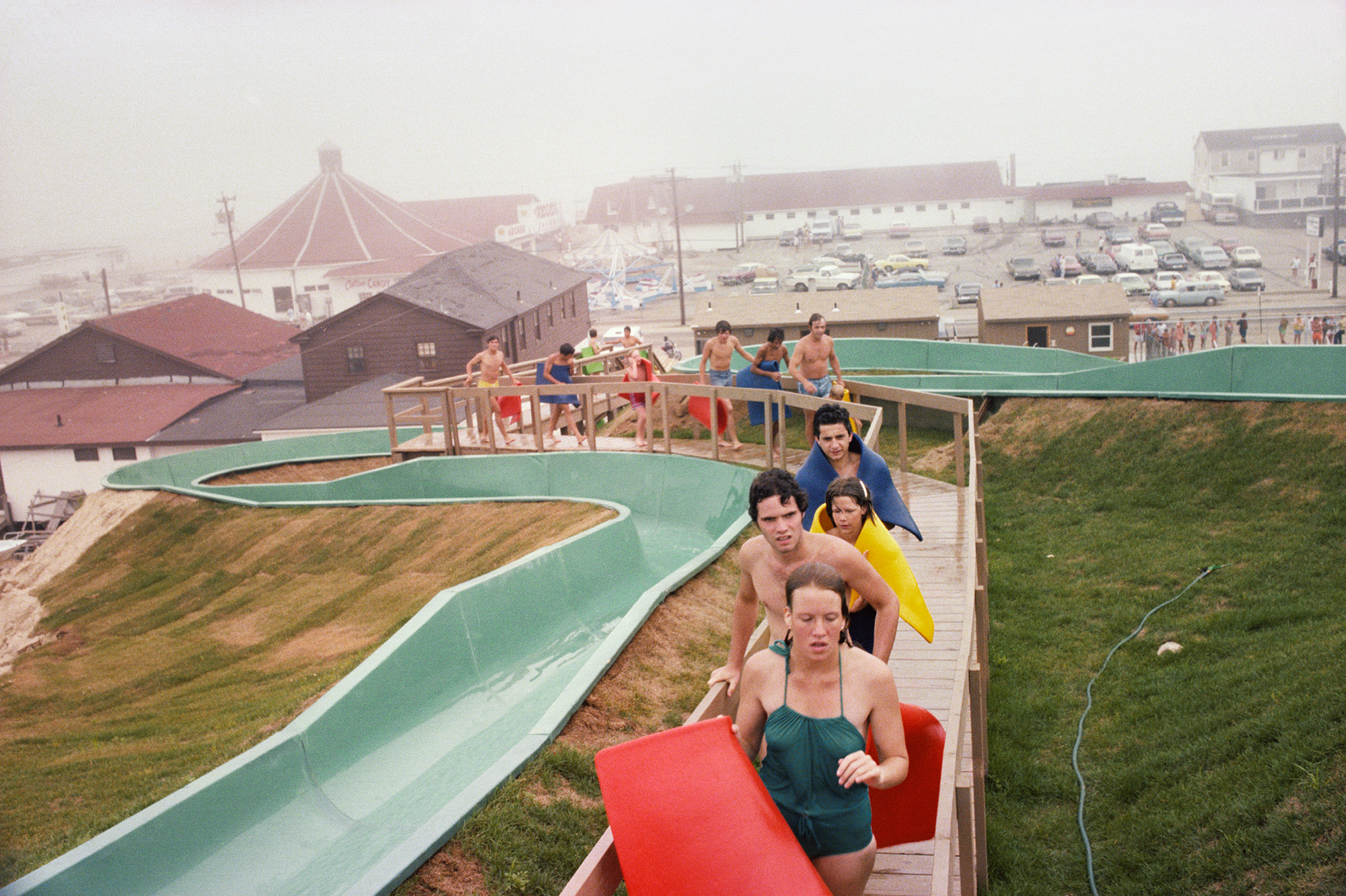 swimmers in line for a water slide