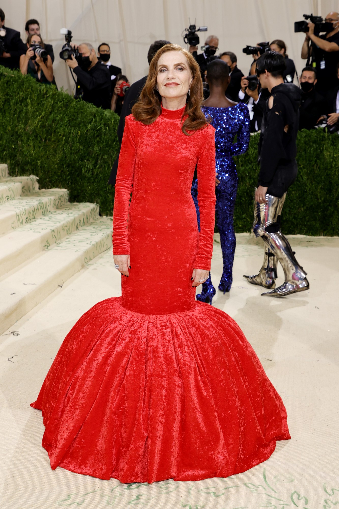 Isabelle Huppert wearing a red Balenciaga dress at the Met Gala in 2021