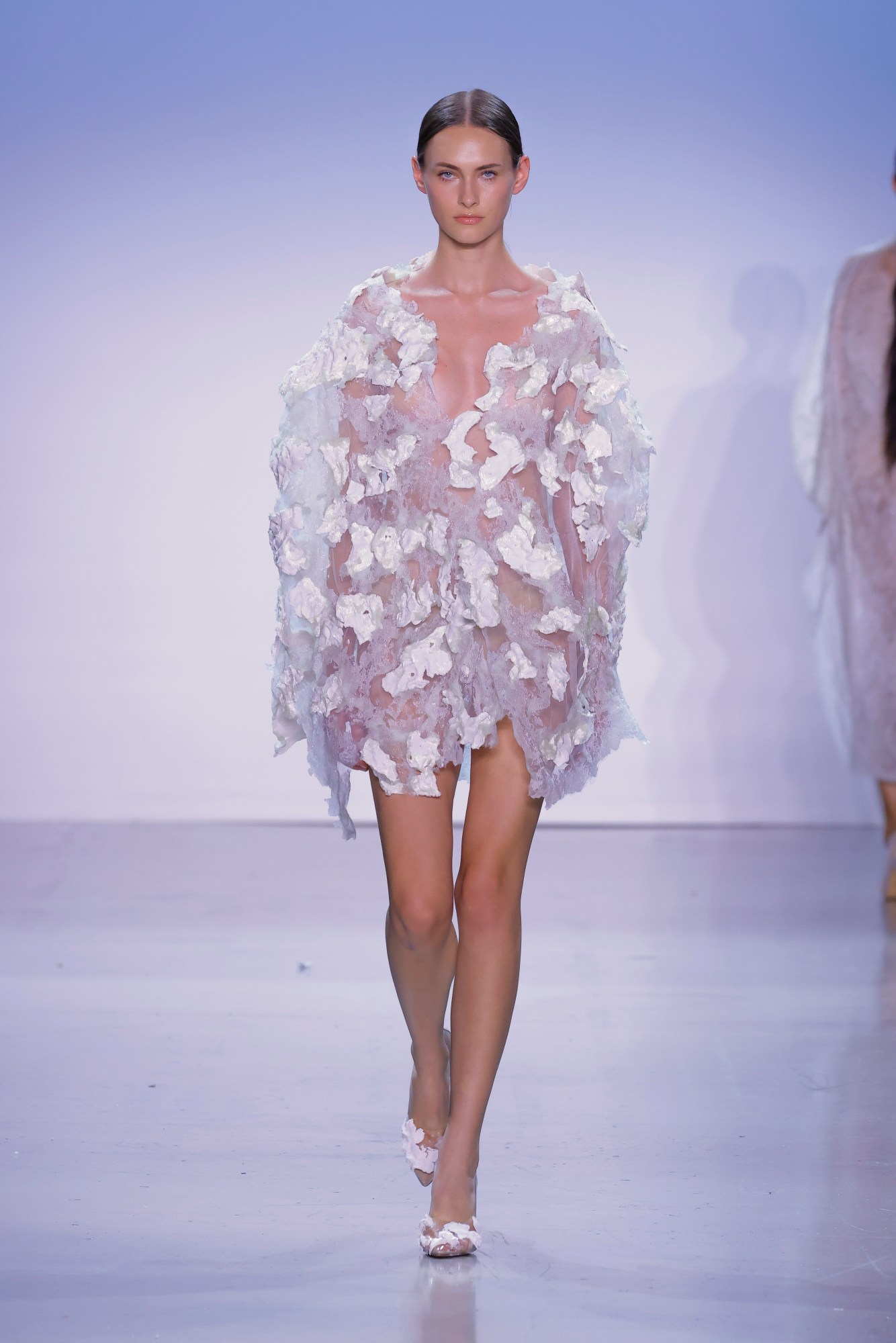 a model wearing tom zhendong wen's fit mfa graduate collection