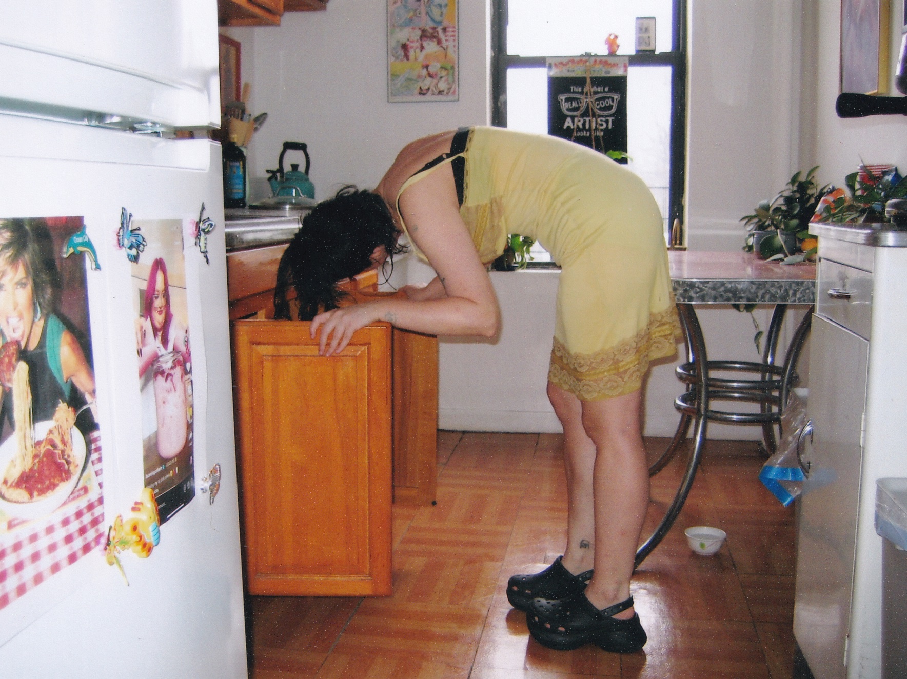 molly soda looking in cabinets in her kitchen in her book chick magnet