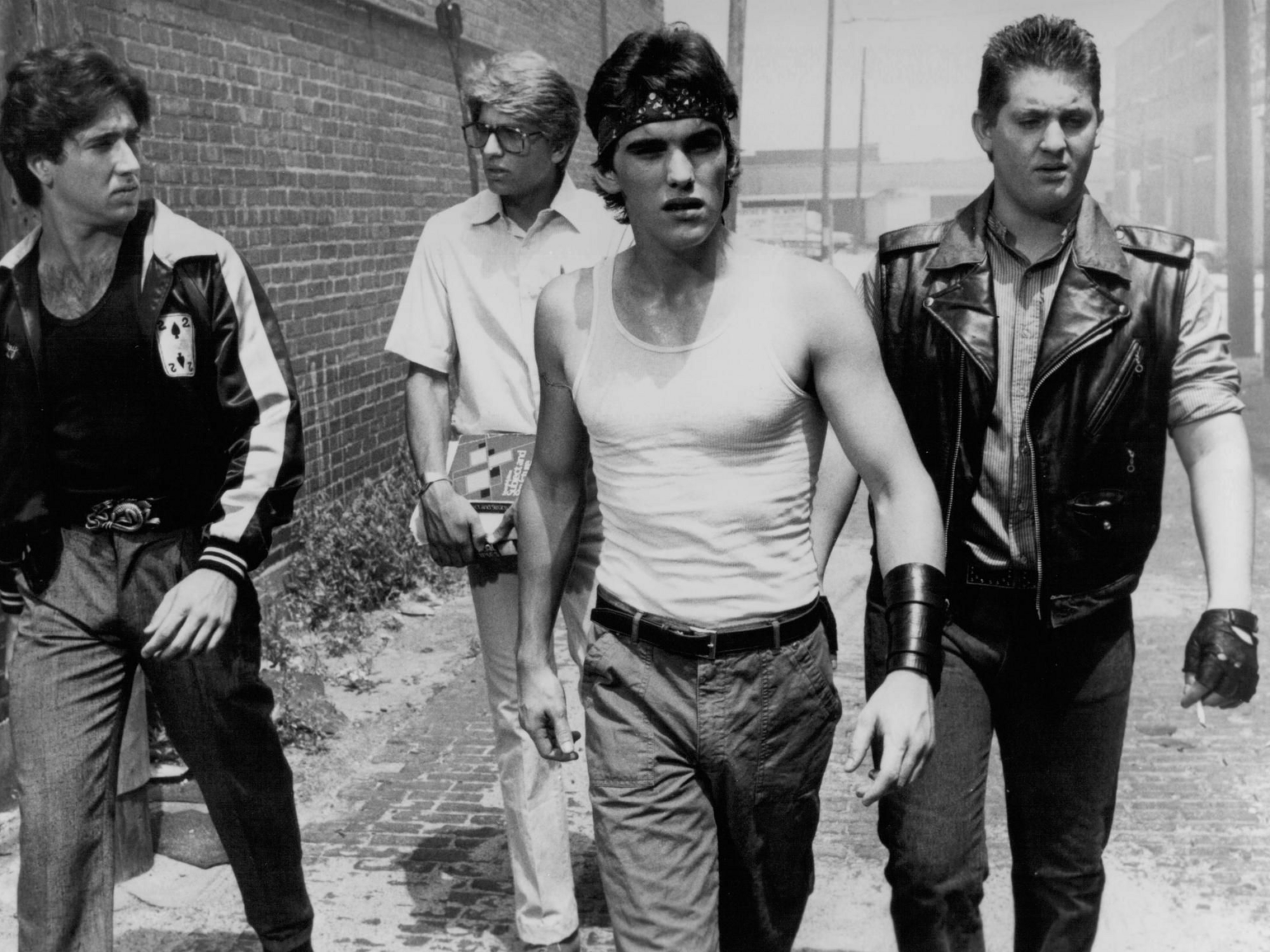 four gang members walking down the street in the film Rumble Fish (1983)