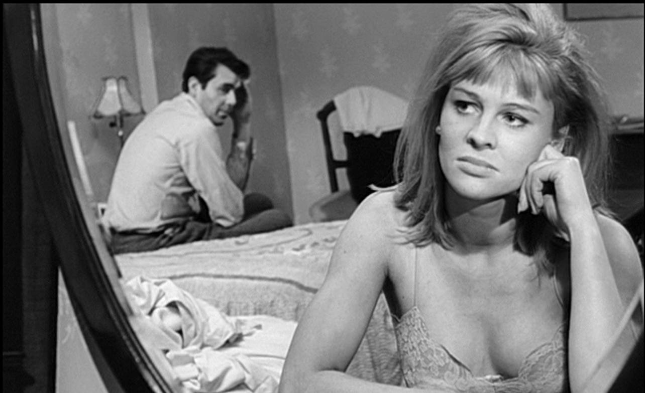 Julie Christie looking in the mirror in the film Darling (1965)