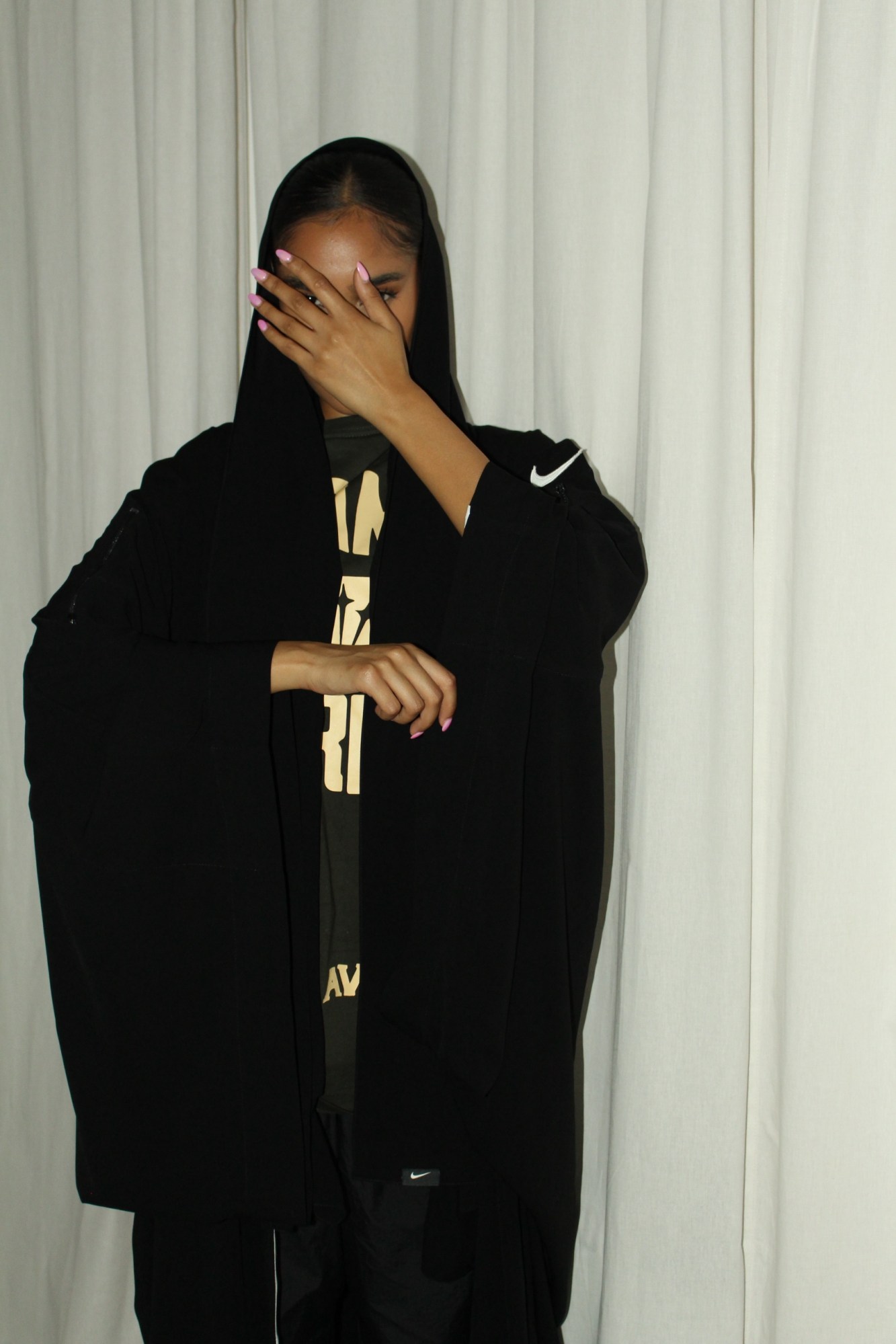 a model wearing a nike abaya