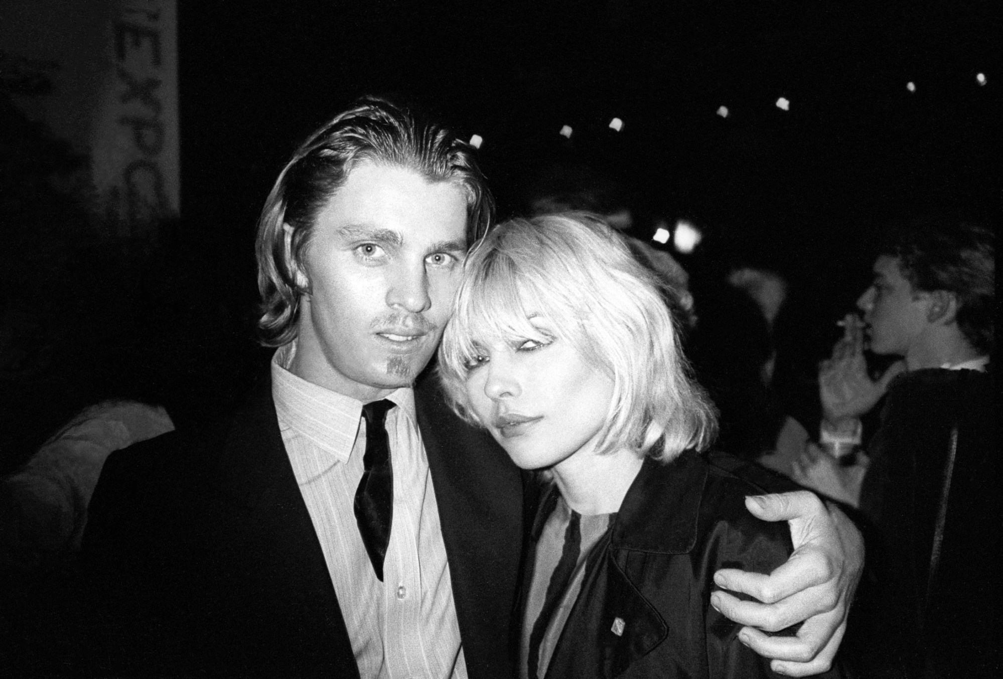 patrick mcmullan photo of christopher makos and debbie harry standing together at an interview magazine party.