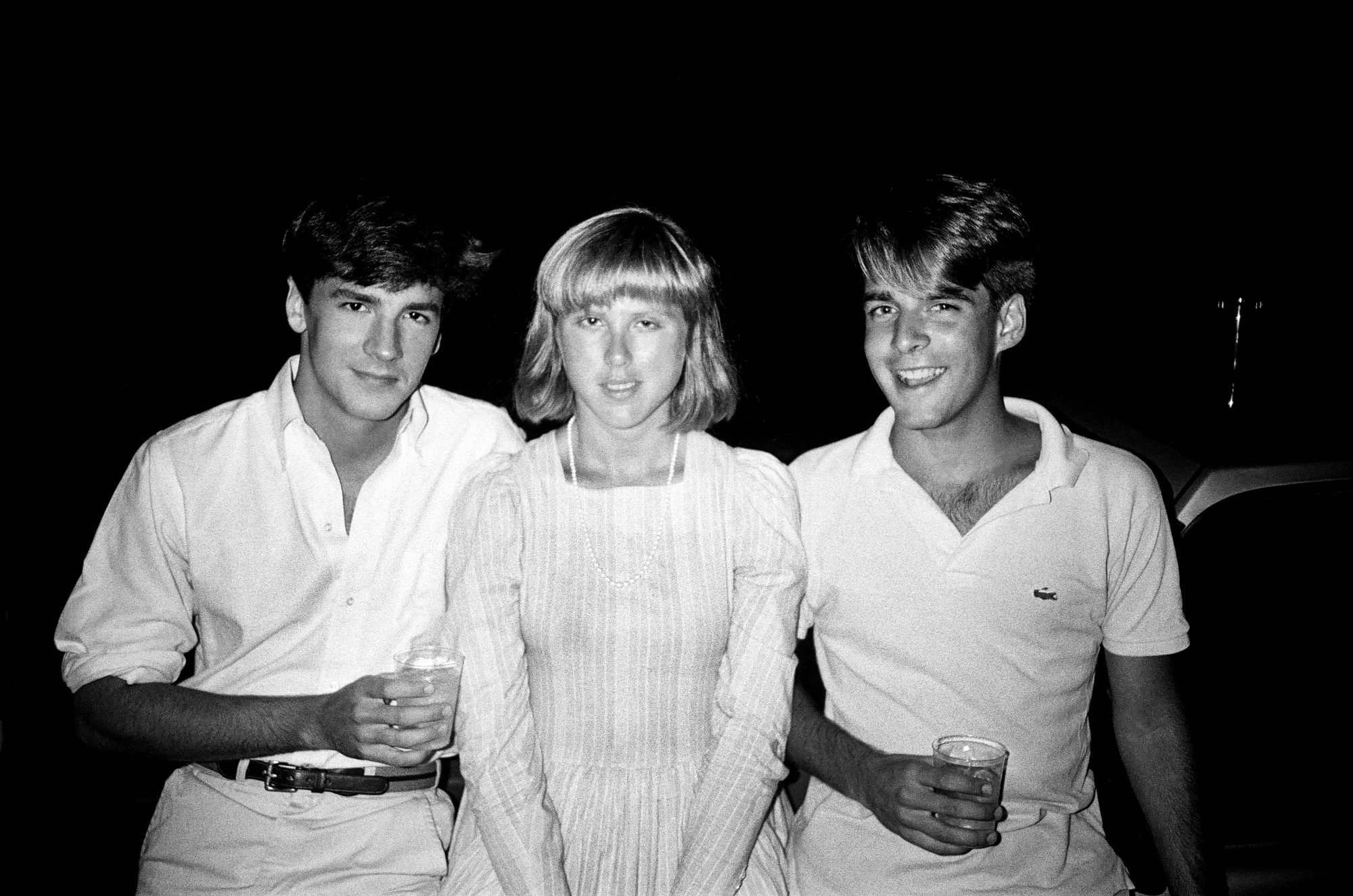 patrick mcmullan photo of tom ford, jill kirby and rob robinson together. all are wearing wite and are looking into the camera smiling