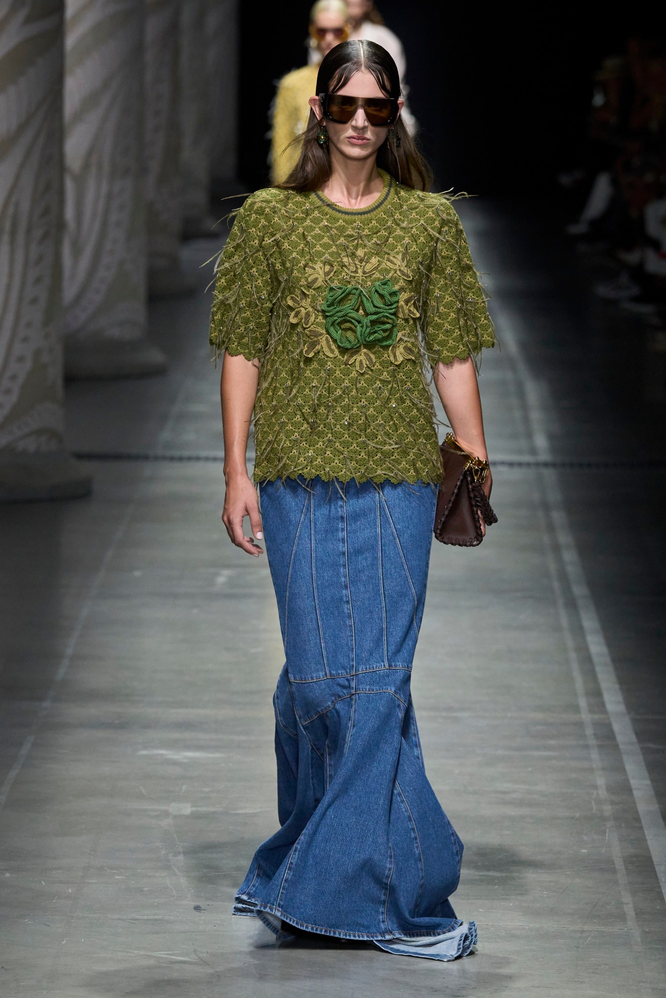 Model wearing hippie style clothes walking for Etro SS24