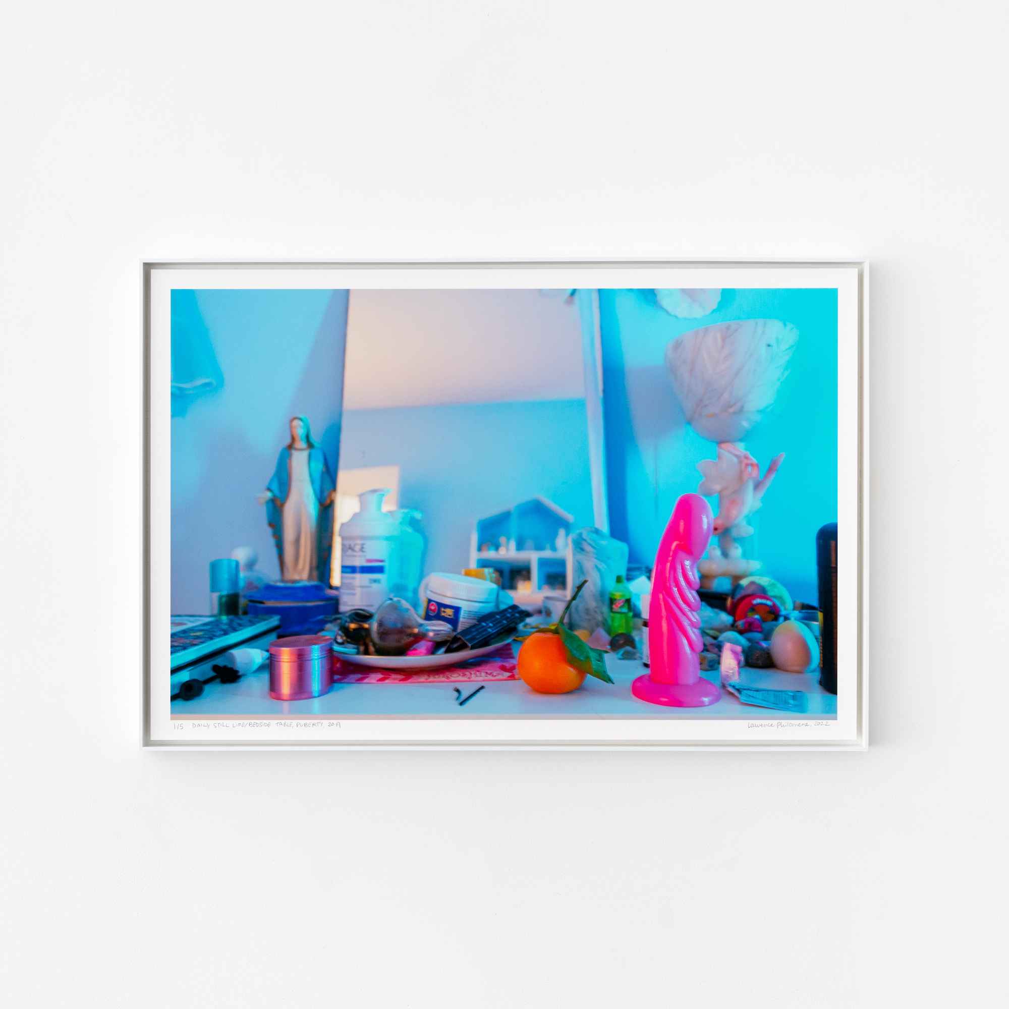 a photograph of a countertop sprinkled with domestic items and a pink dildo