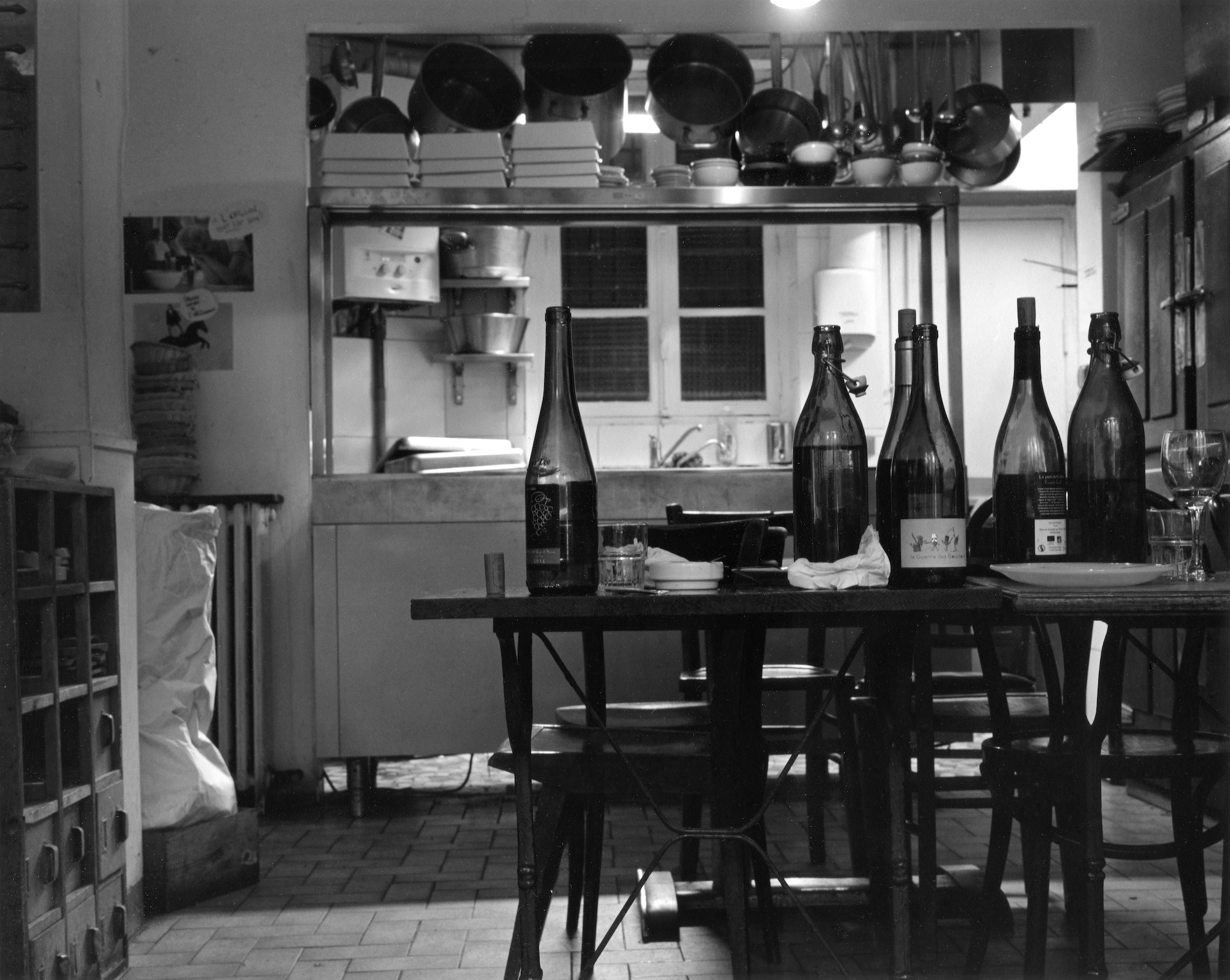 empty bottles on a table at a parisian restaurant