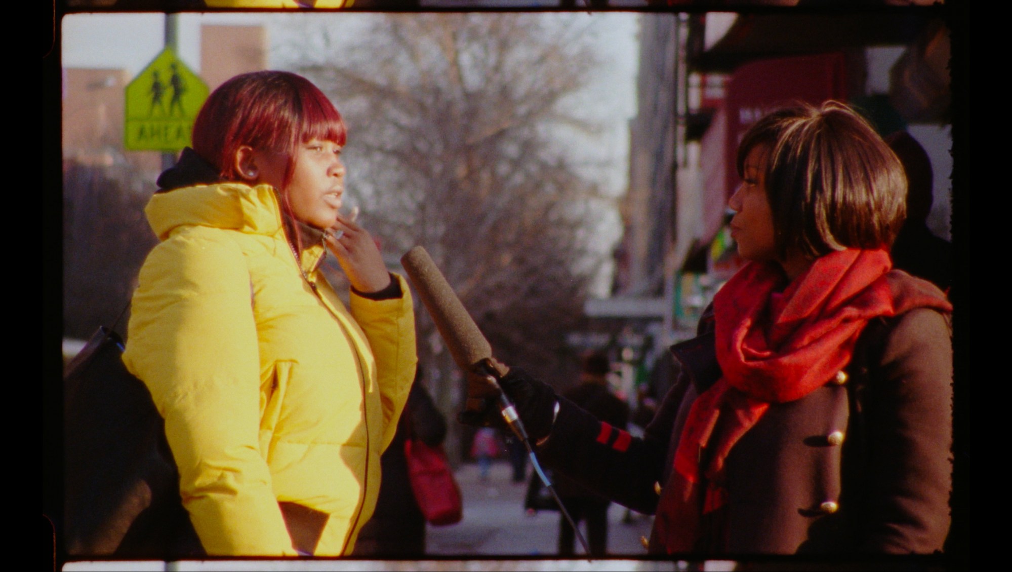 ja'tovia gary speaking to two young women on the street in harlem