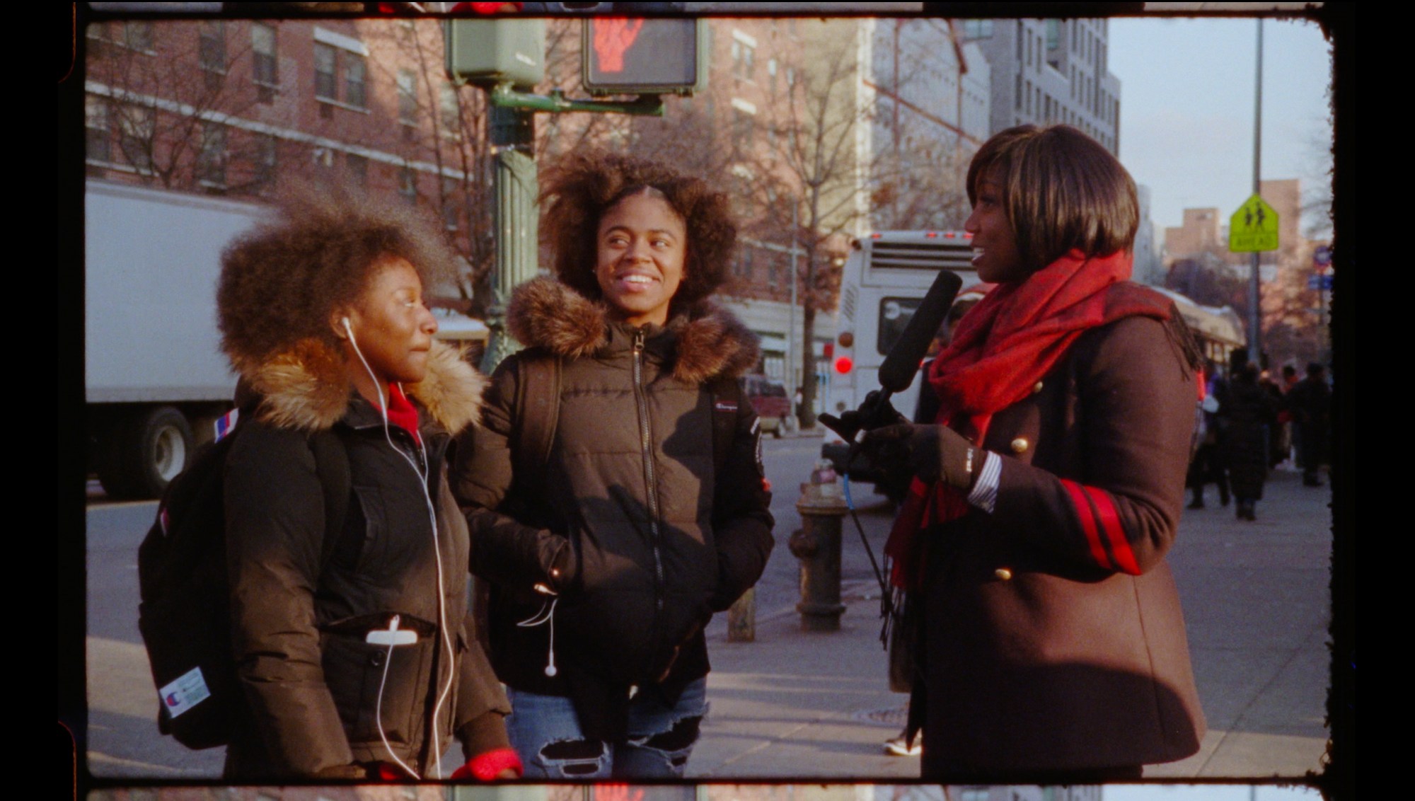 ja'tovia gary speaking to two young women on the street in harlem