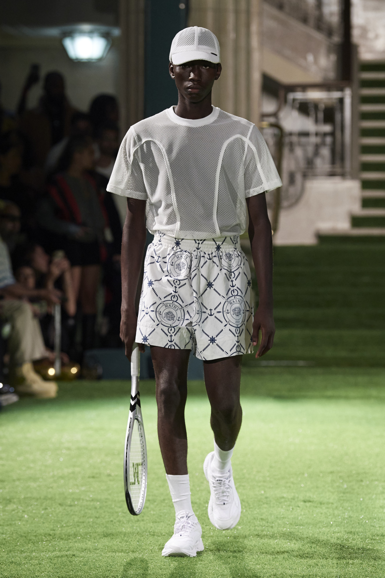 A model walking for the Mains SS24 show