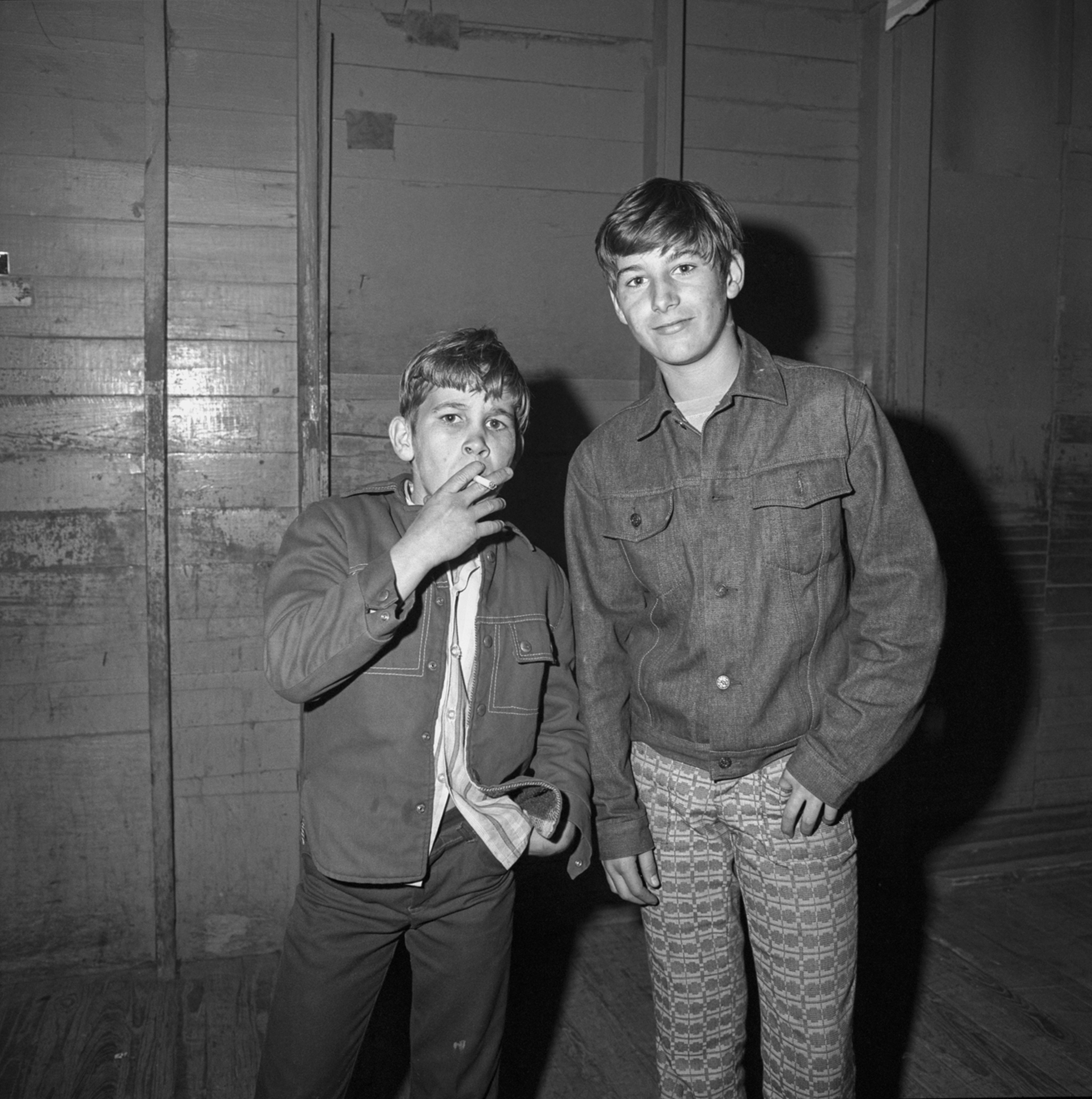 two teenagers smoking outside a roller rink in 1970s florida