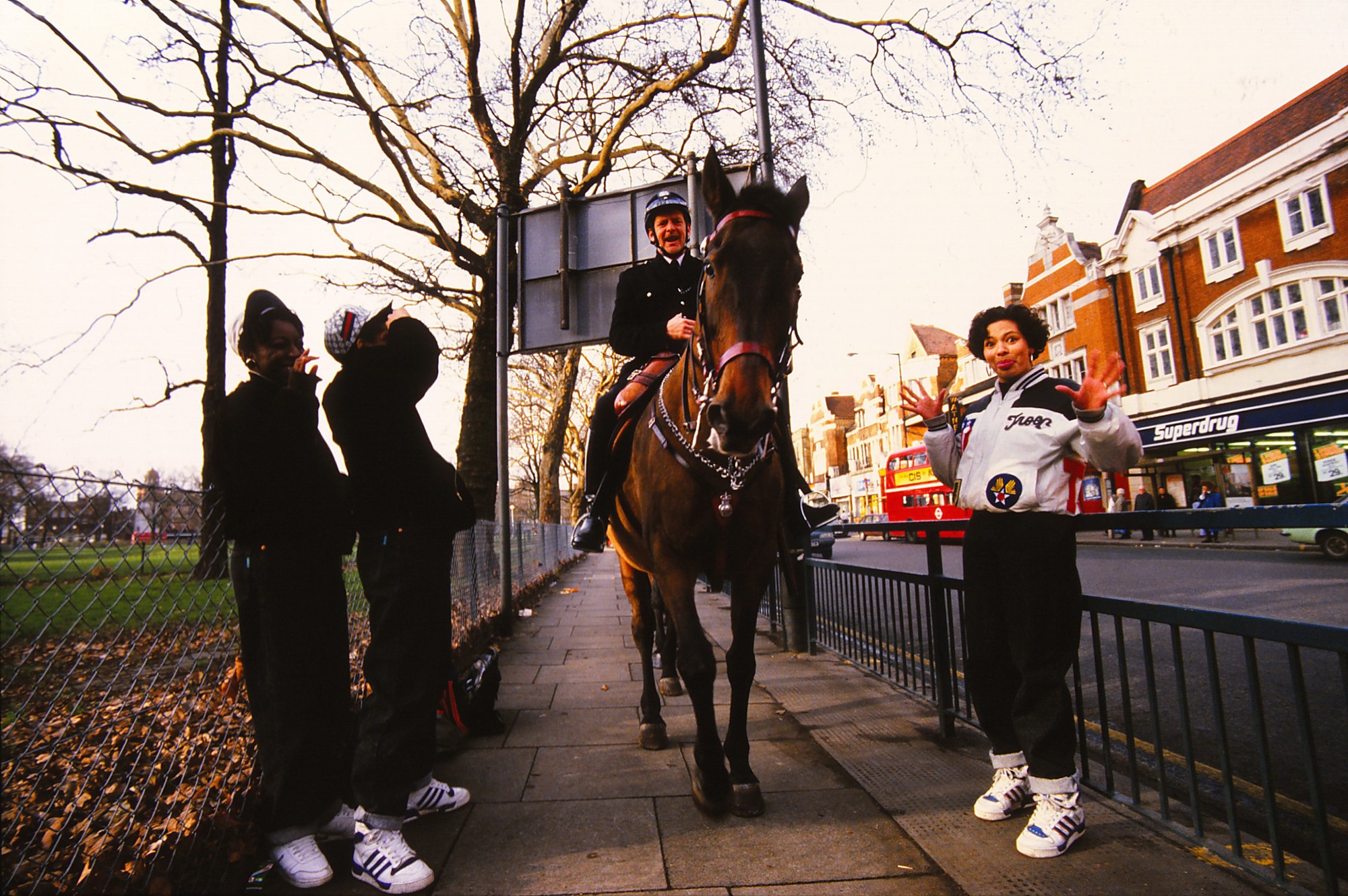 SHE ROCKERS SHOOT WITH HORSE BACK POLICE INTRUDING - SHEPHERDS BUSH. 1988 copy.jpg