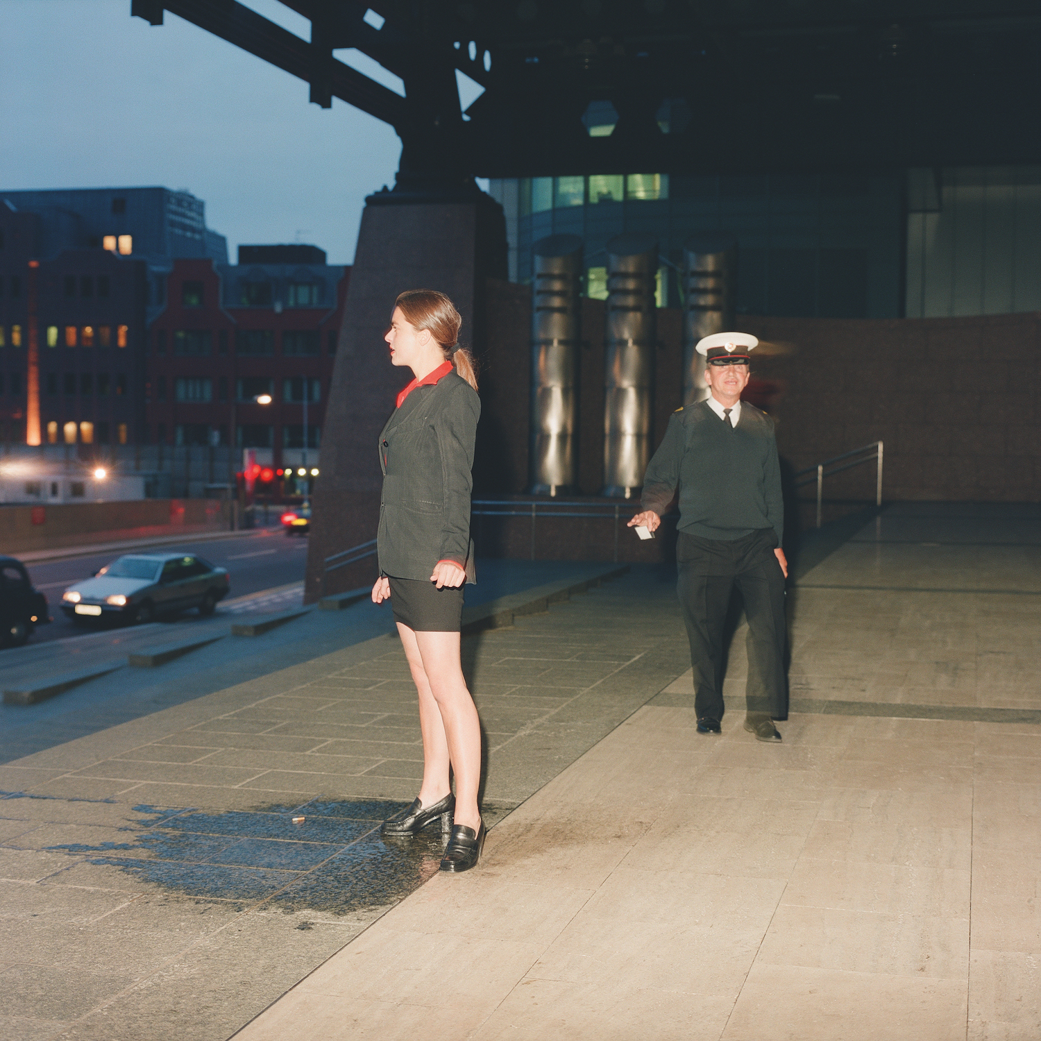 woman in black skirt suit peeing on the ground