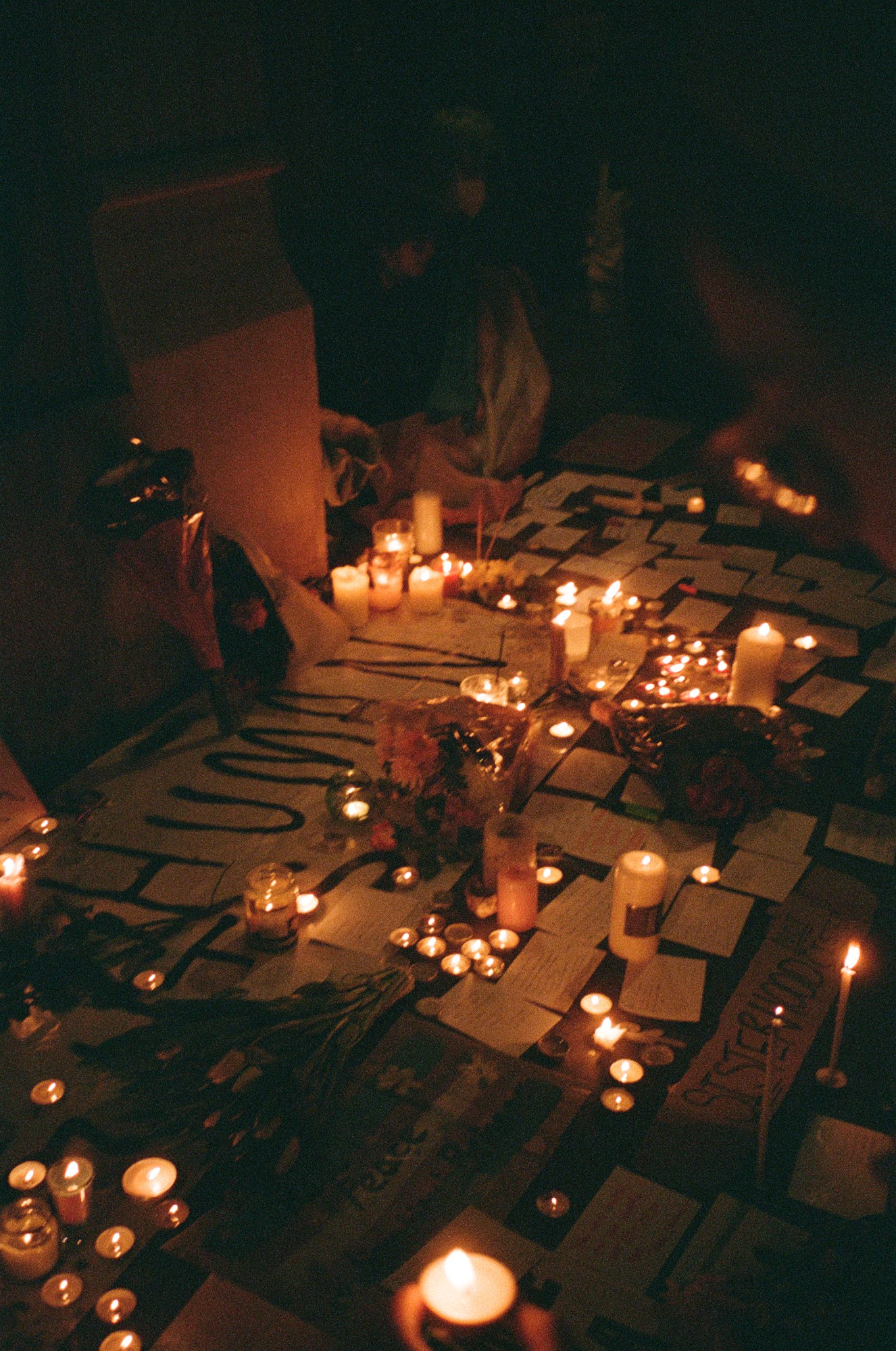 candlelight vigil for Brianna Ghey and a sign that reads human in london