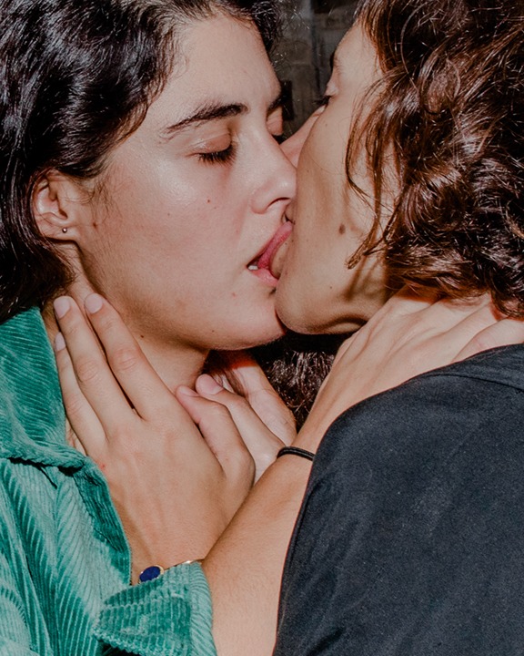 two women kissing passionately