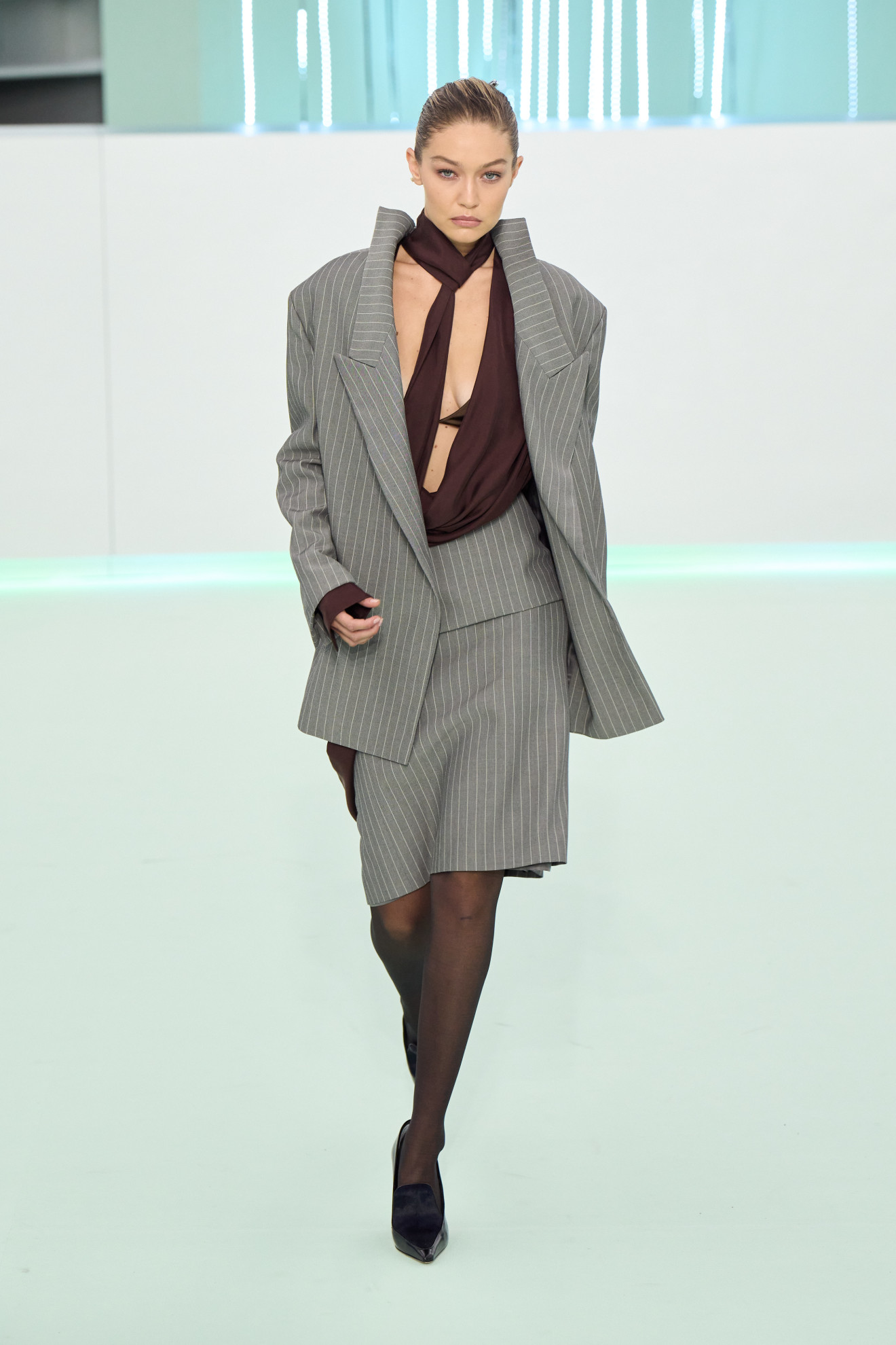 Halloween costume inspiration of a model dressed as a corpcore business woman on the BOSS SS24 runway