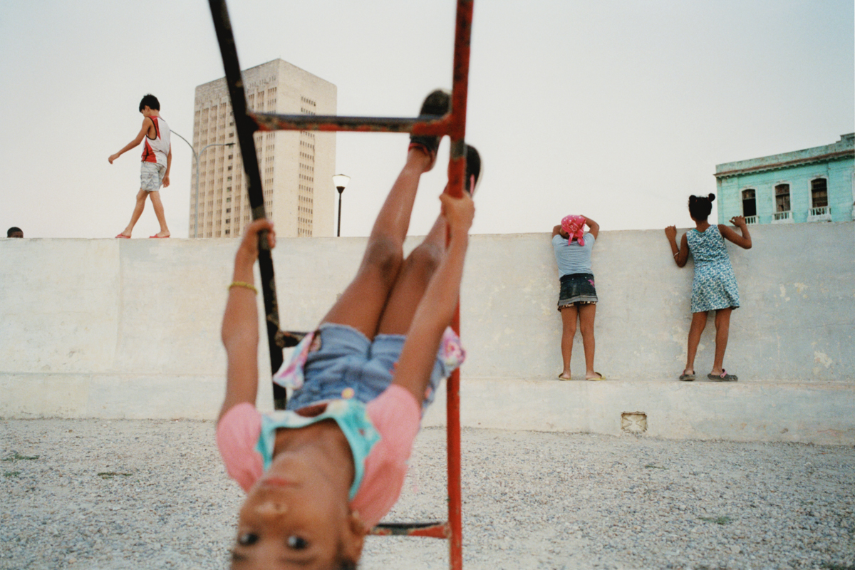 a young girl on monkey bars