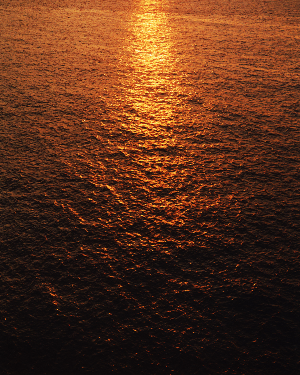 sunlight on the ocean at sunset