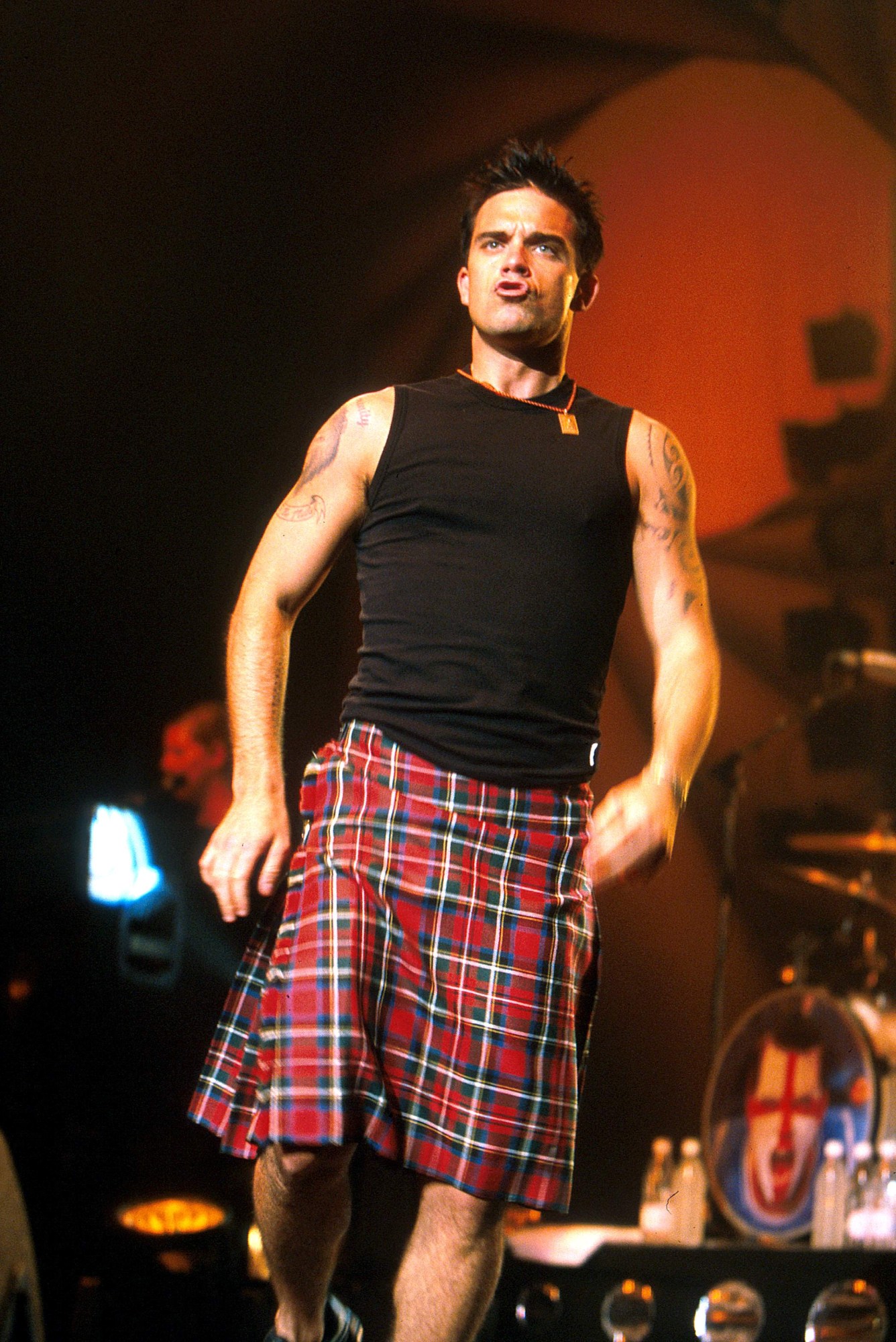 robbie williams wearing a kilt during a 2002 performance in australia