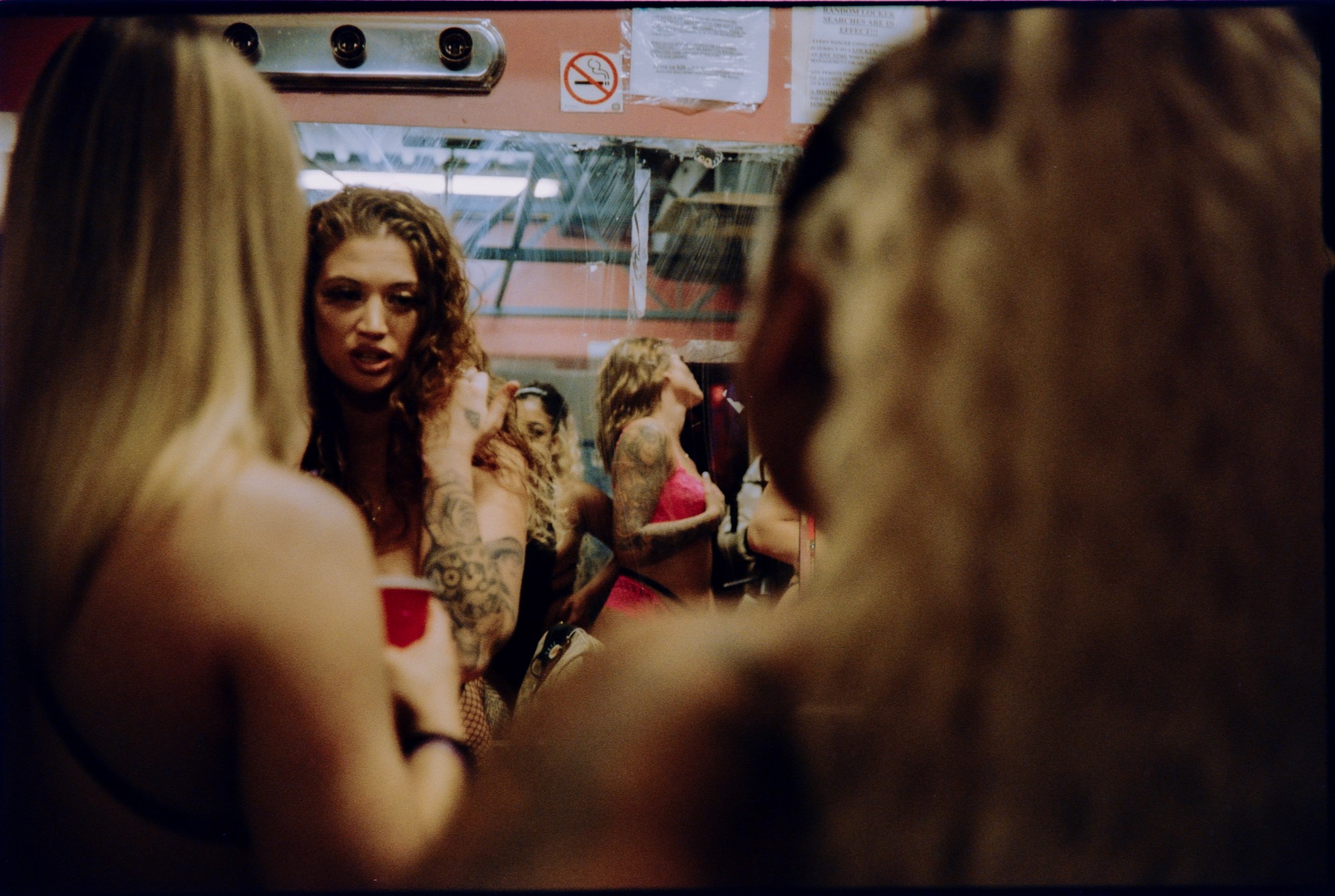 a group of women in a changing room for a club