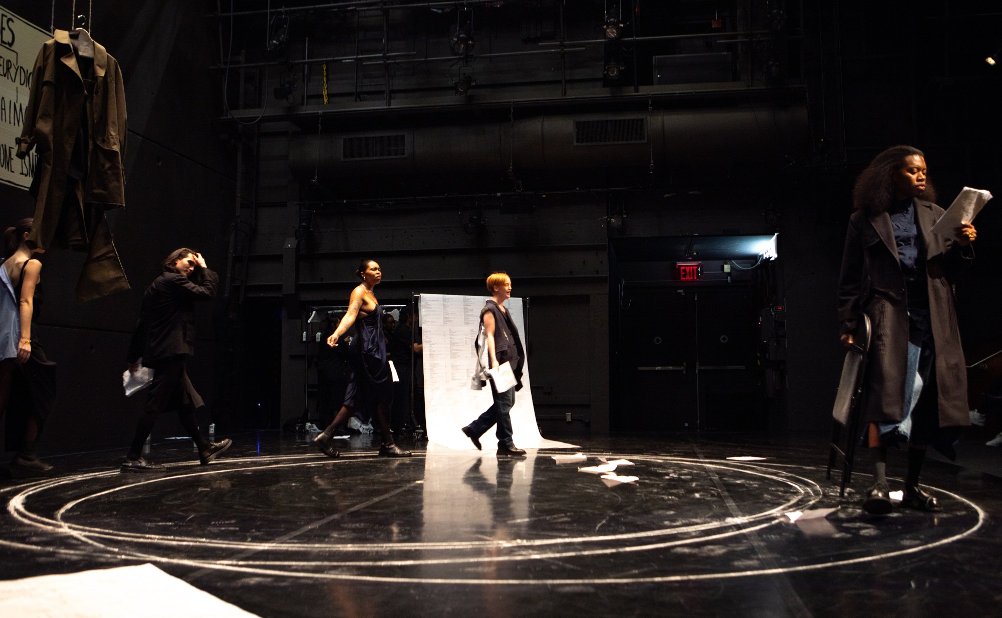 actors walking on a stage