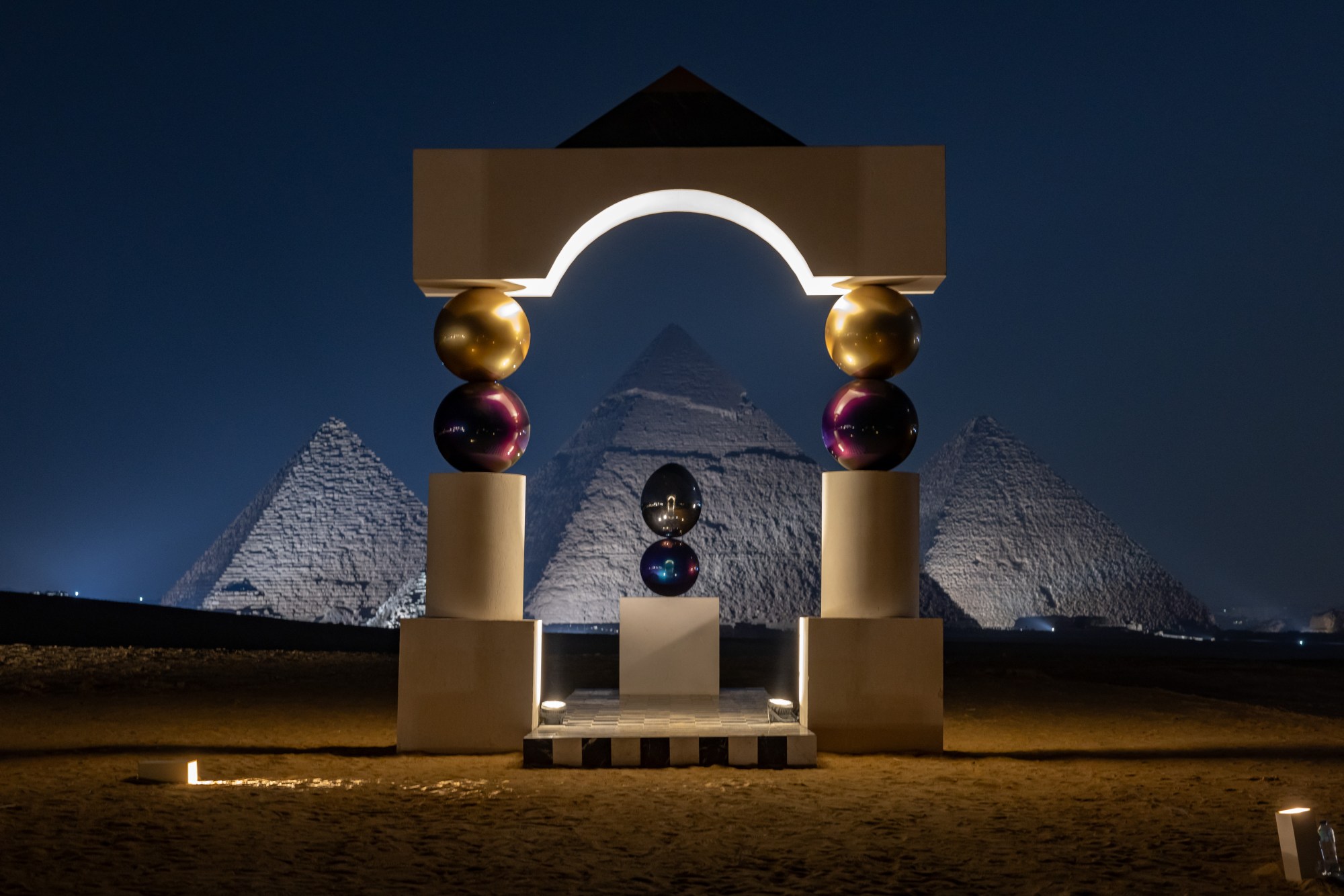 a scultpure by pilar zeta located at the base of the pyramids in eygpt