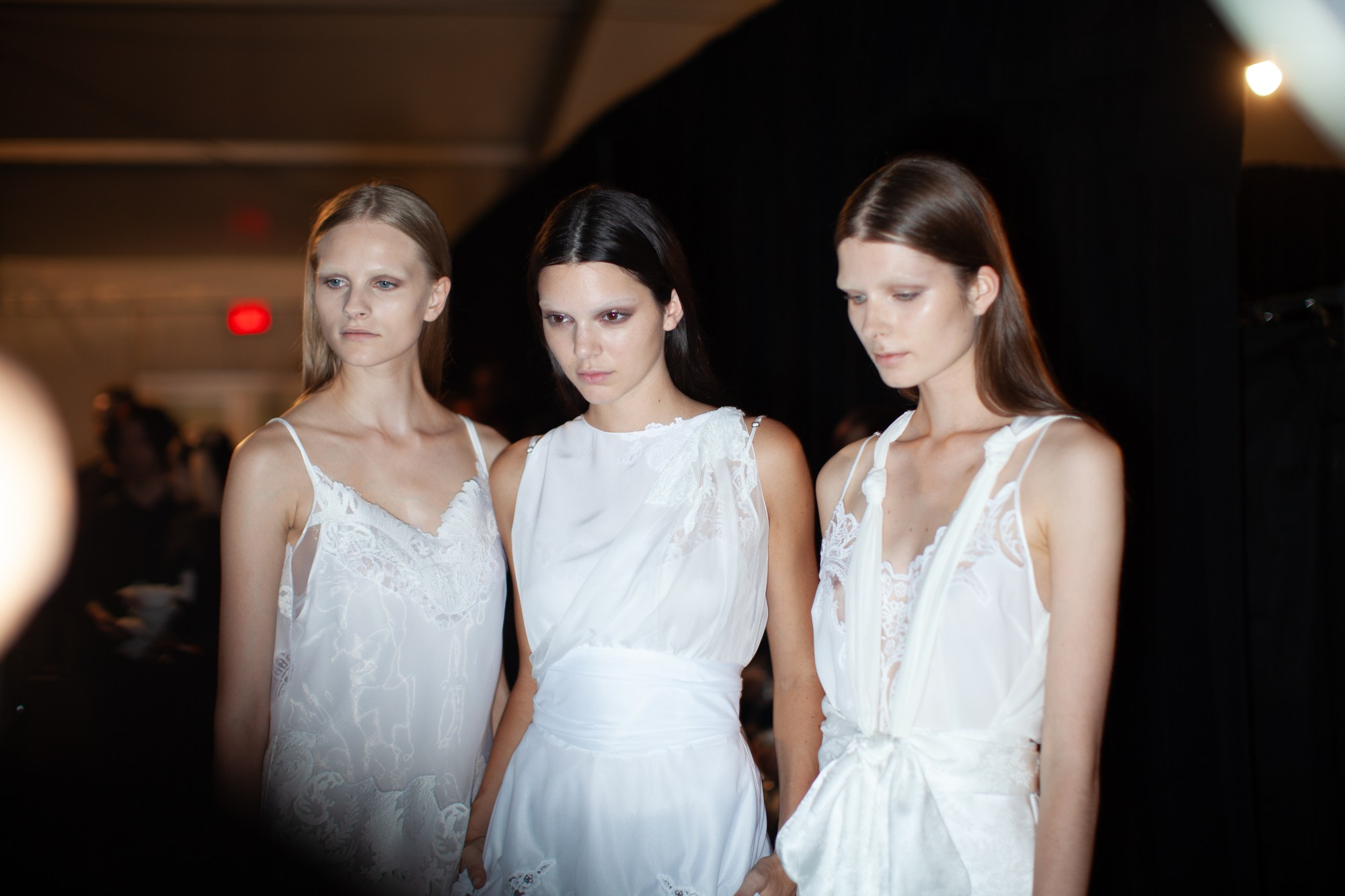 kendall jenner and models backstage in white dresses photographed by joshua woods