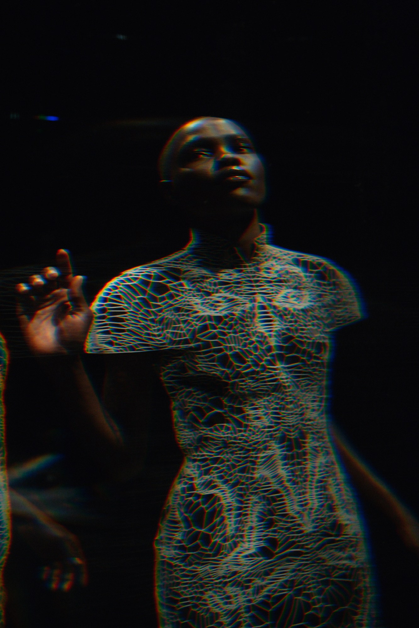 glitchy photograph of iris van herpen hologram show by joshua woods