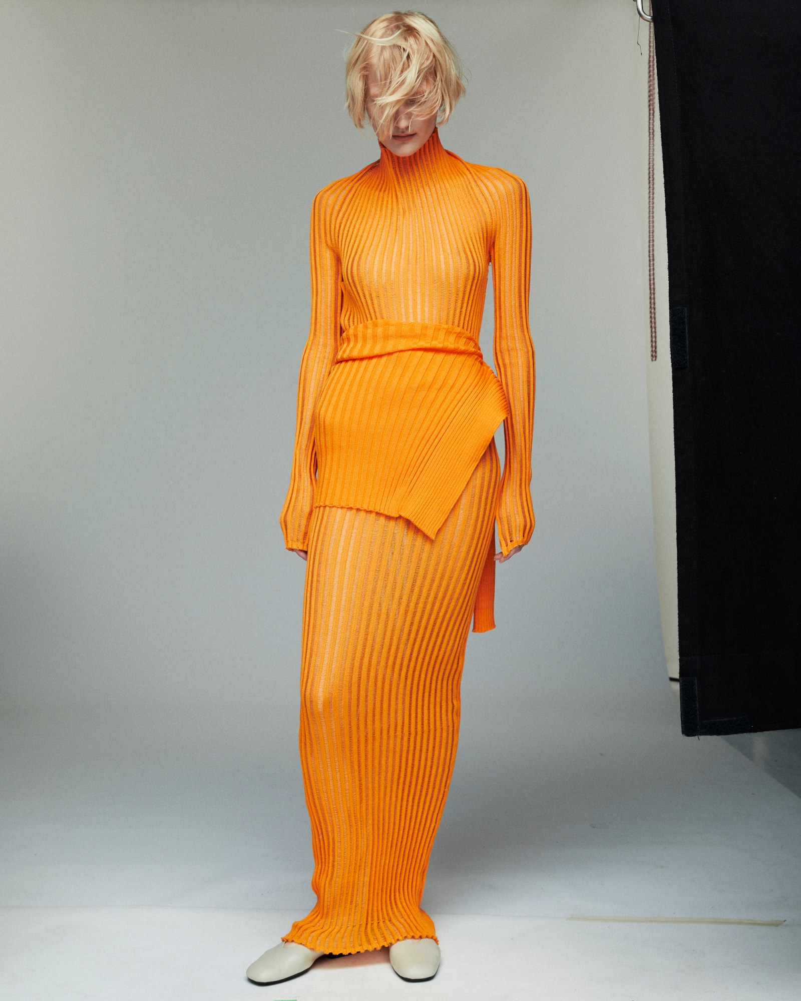 bright orange a. roege hove ss24 knit dress photographed by maria and louise thornfeldt