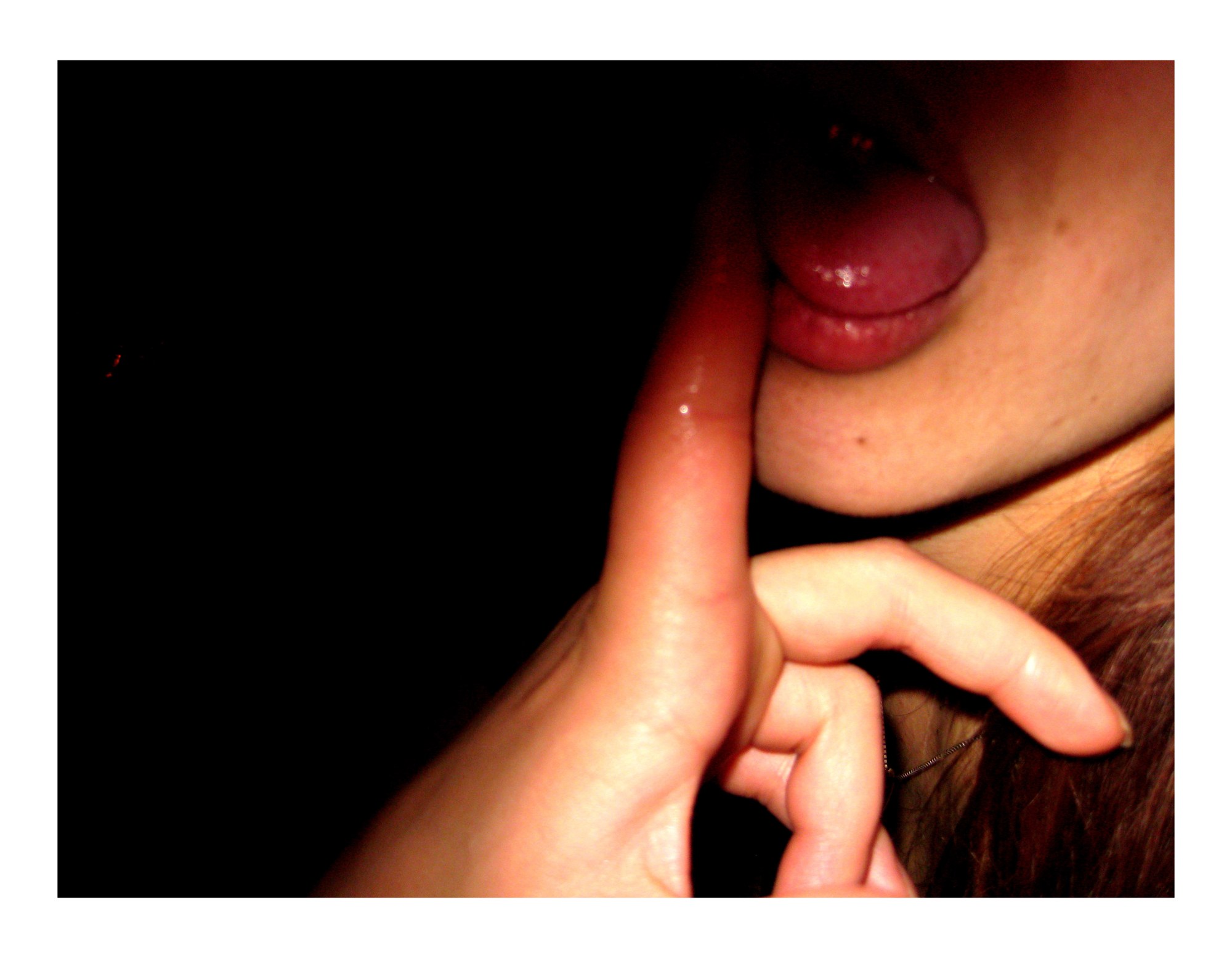 a finger on someone's tongue in the shadows of a tokyo hostess club