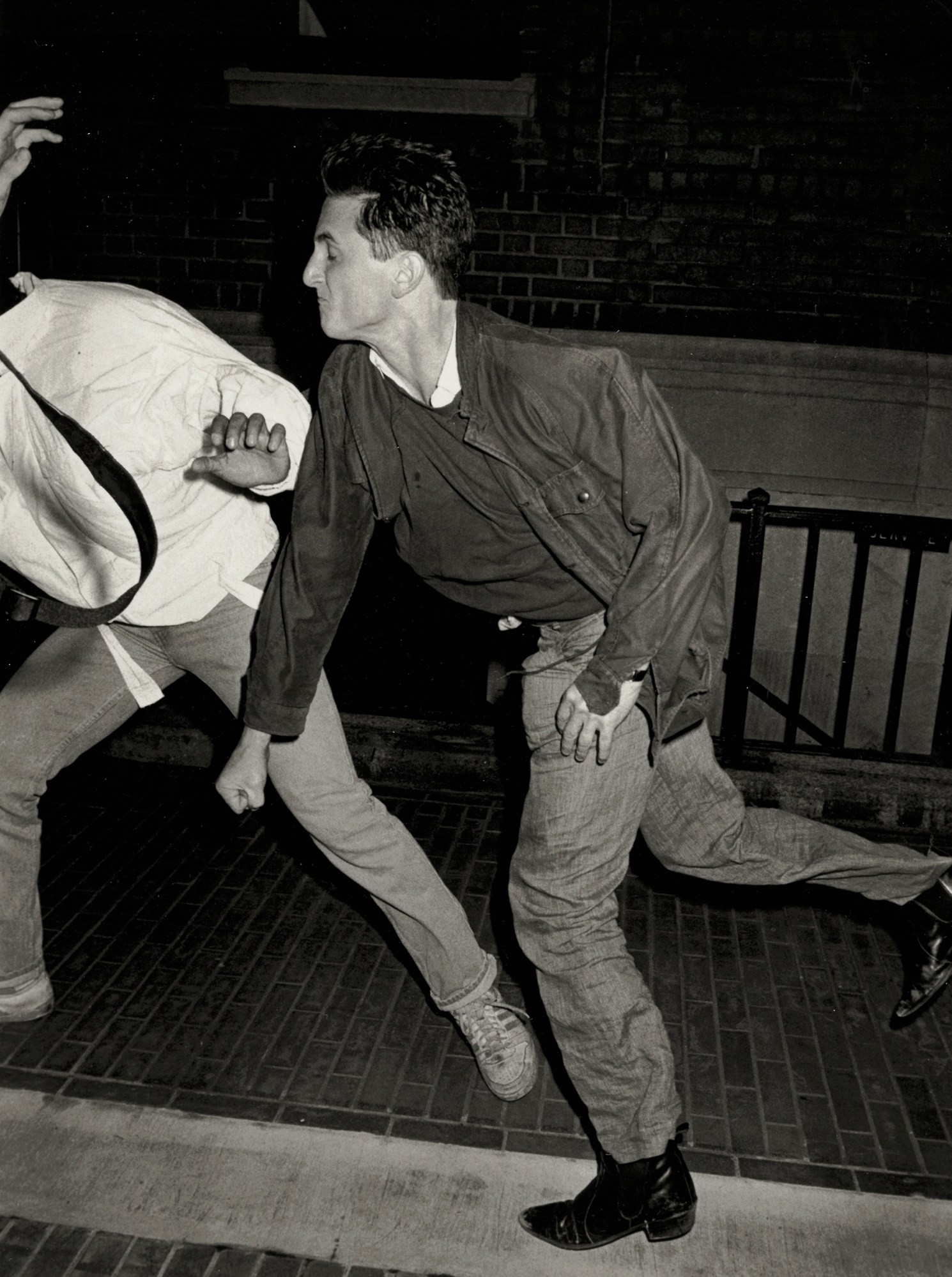 actor sean penn mid punch in a new york street