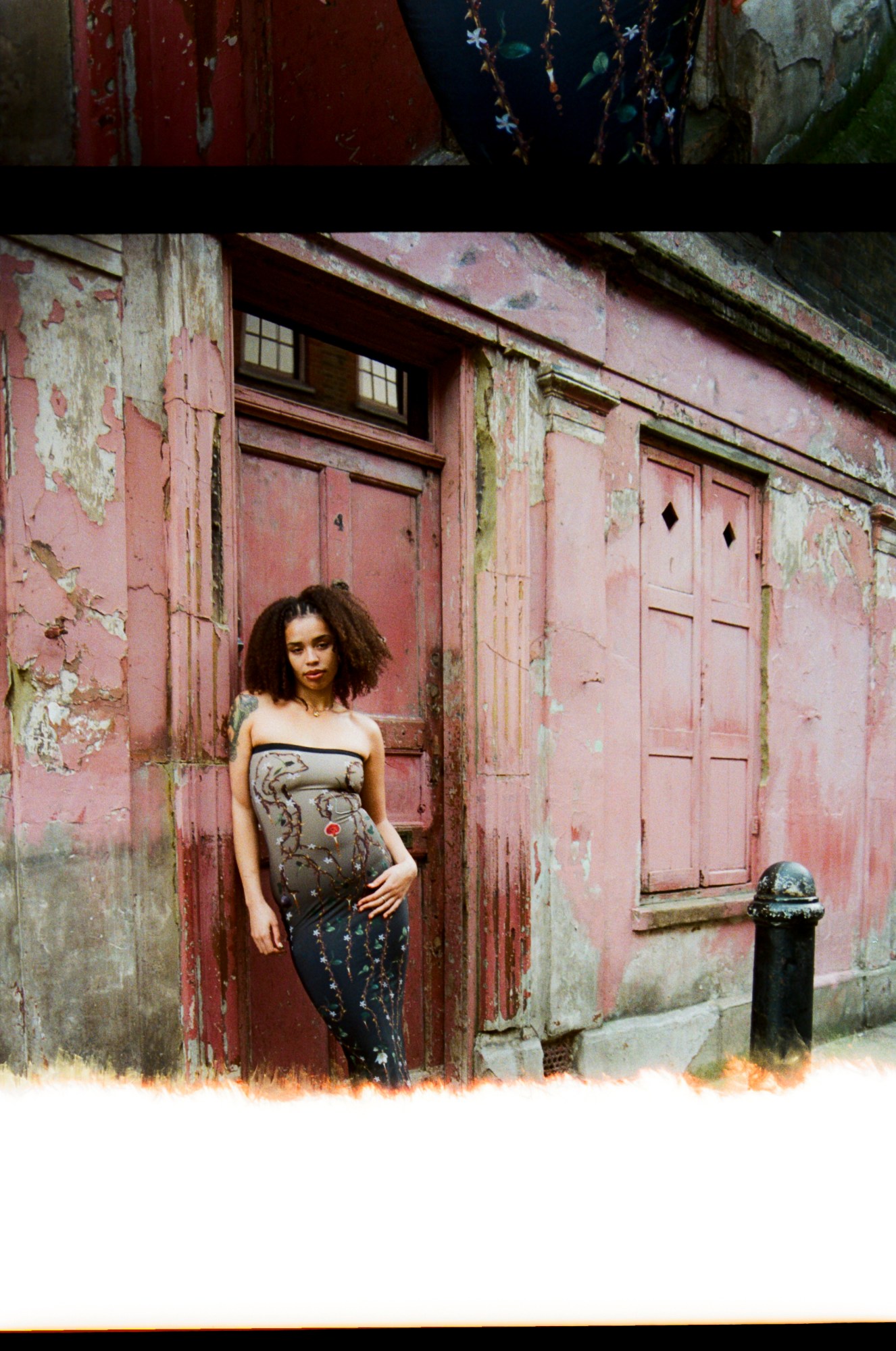 a faded print of bel cobain standing on a cobbled street in hackney