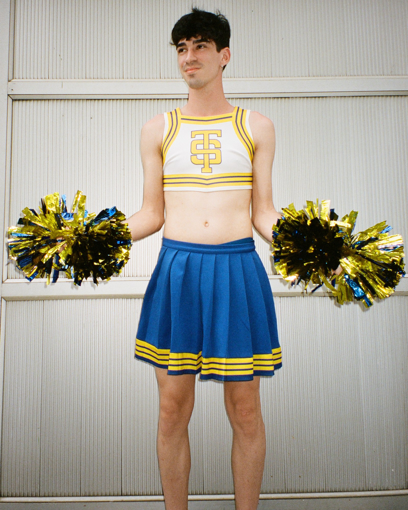 Photograph by Pedro Pinho of a Taylor Swift fan wearing a 1989 inspired cheerleader outfit at the Eras Tour in Brazil