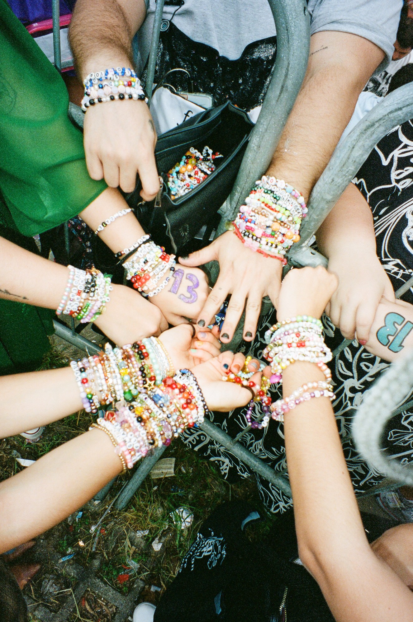 Photograph by Pedro Pinho of Taylor Swift fans bead lyric bracelets at the Eras Tour in Brazil