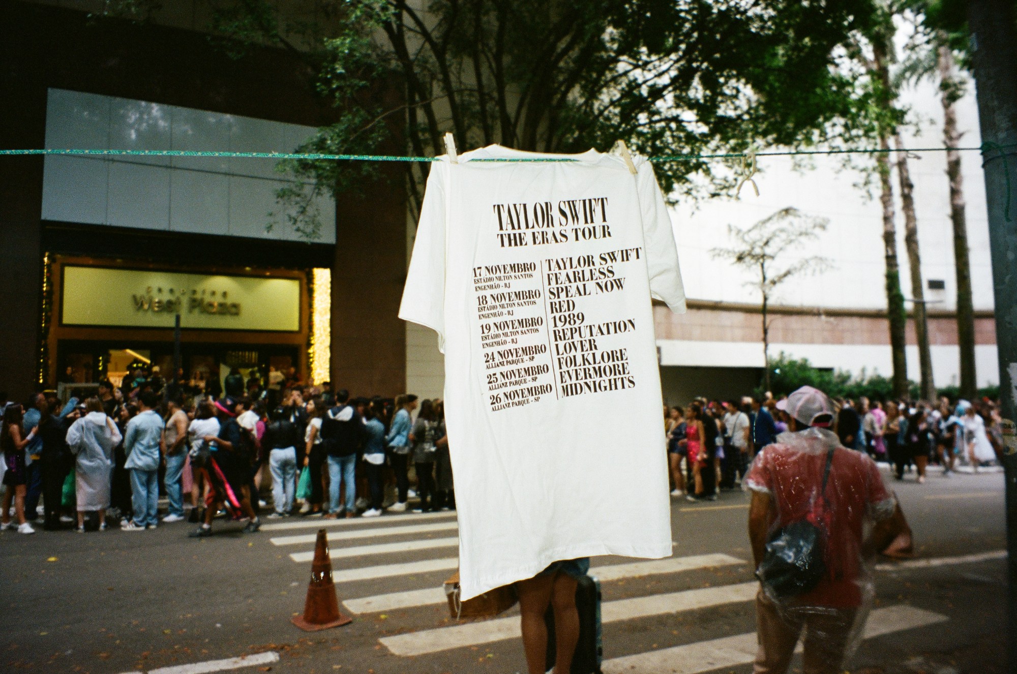 Photograph by Pedro Pinho of Taylor Swift Eras Tour in Brazil t-shirt hanging on a line on the road