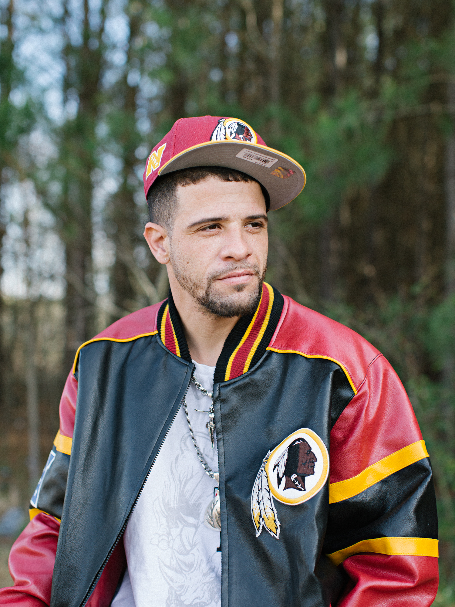 Scottie in a washington redskins letterman jacket