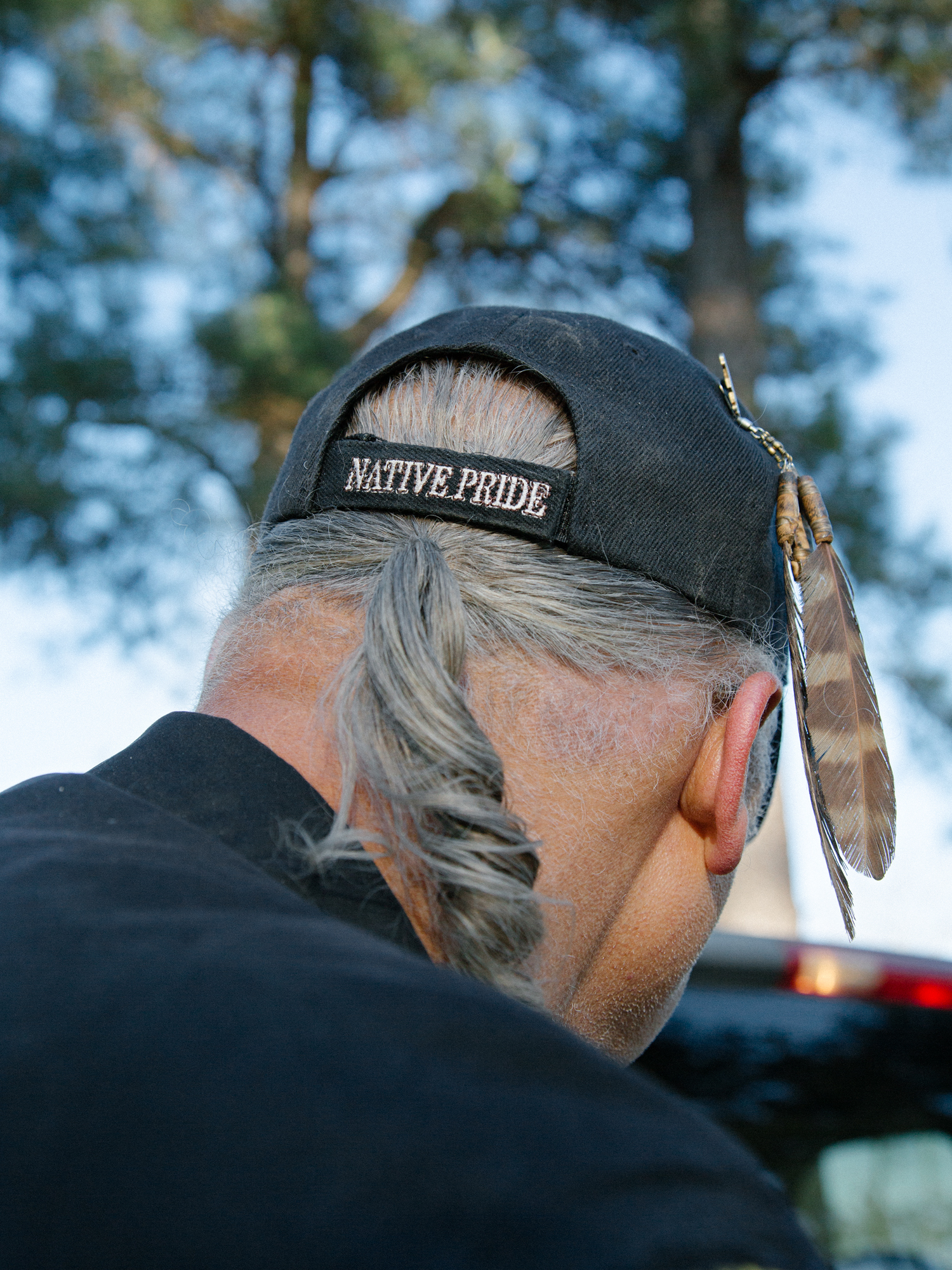 the back of a hat that says native pride and a rat tail hanging out