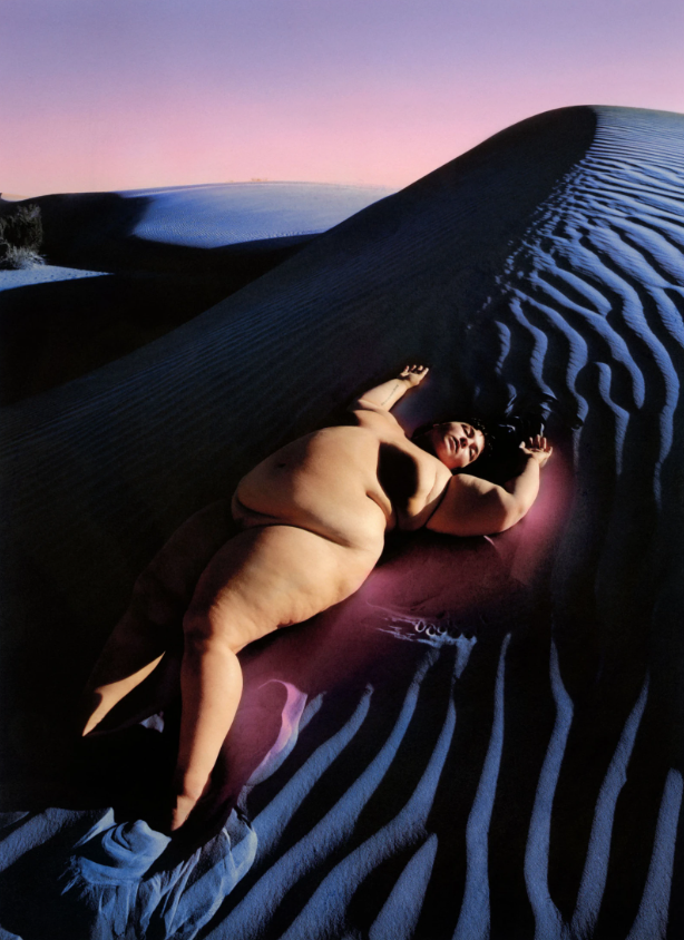 Photograph by Shae Detar of a woman lying naked on blue sand from Another World