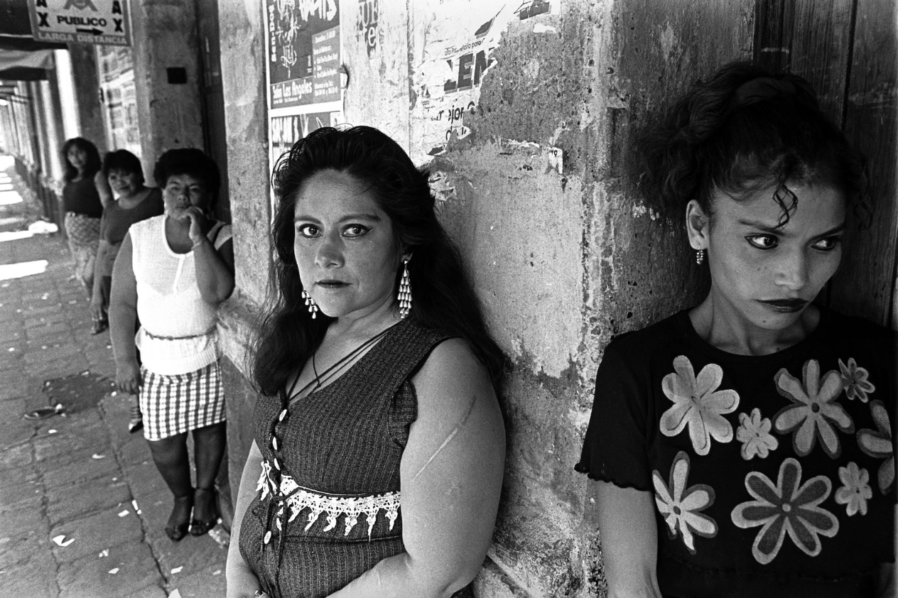 Photograph by Joseph Rodriguez of mexico city sex workers in the 90s standing against the wall