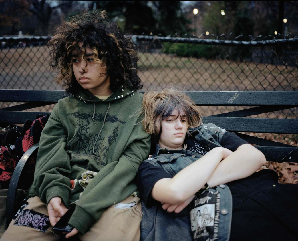 Photograph of two teen girls on a park bench in the East Village photographed by Sara Messinger