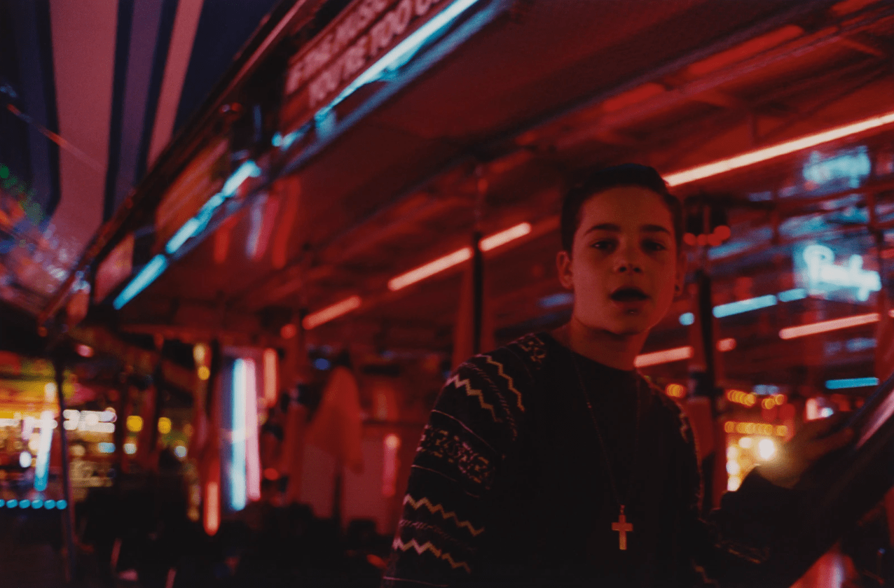 Photograph by Paolo Zerbini of a teenager at a fun fair in the book Tagada