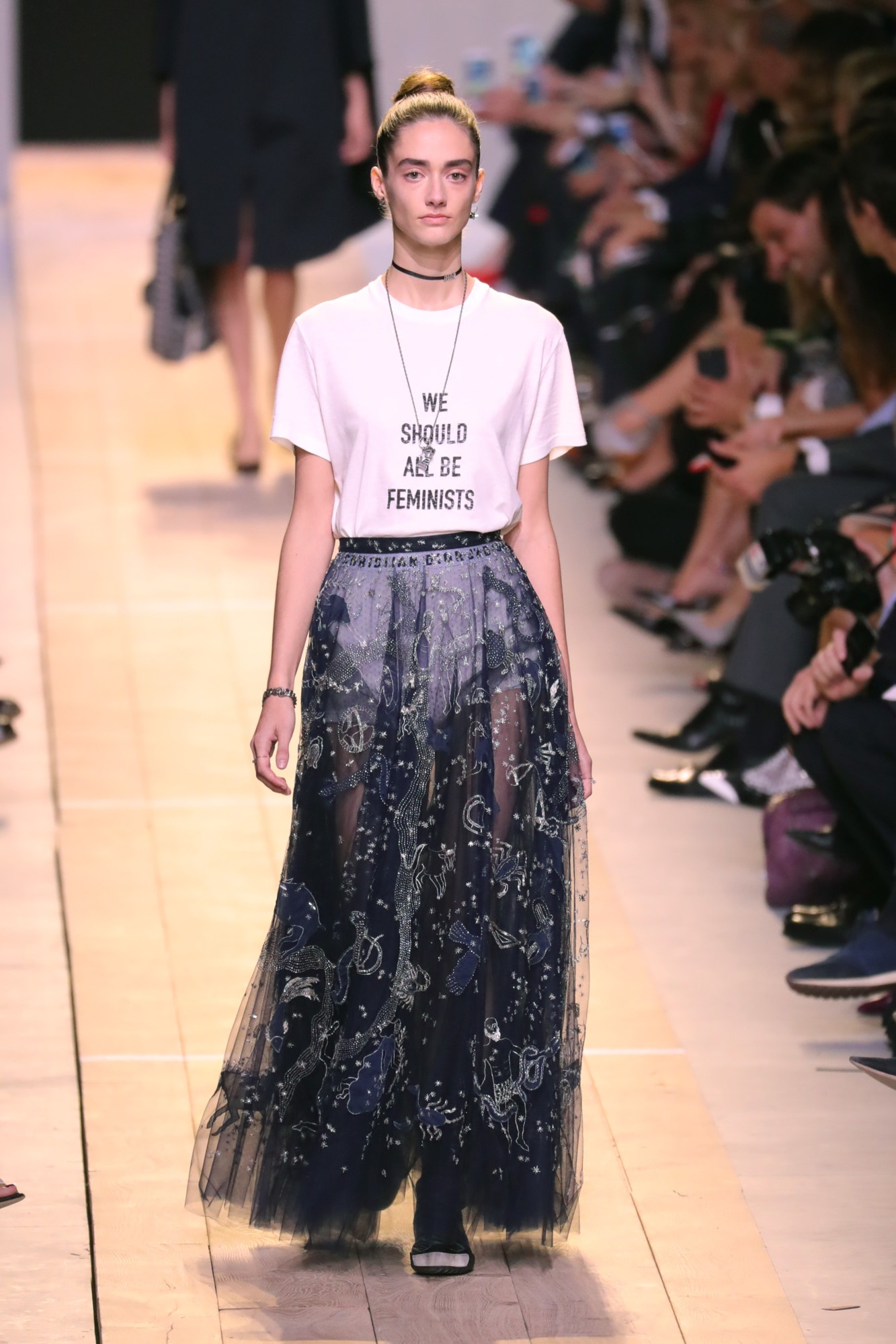 Model wearing the dior we should all be feminists t-shirt at the Dior SS17 show