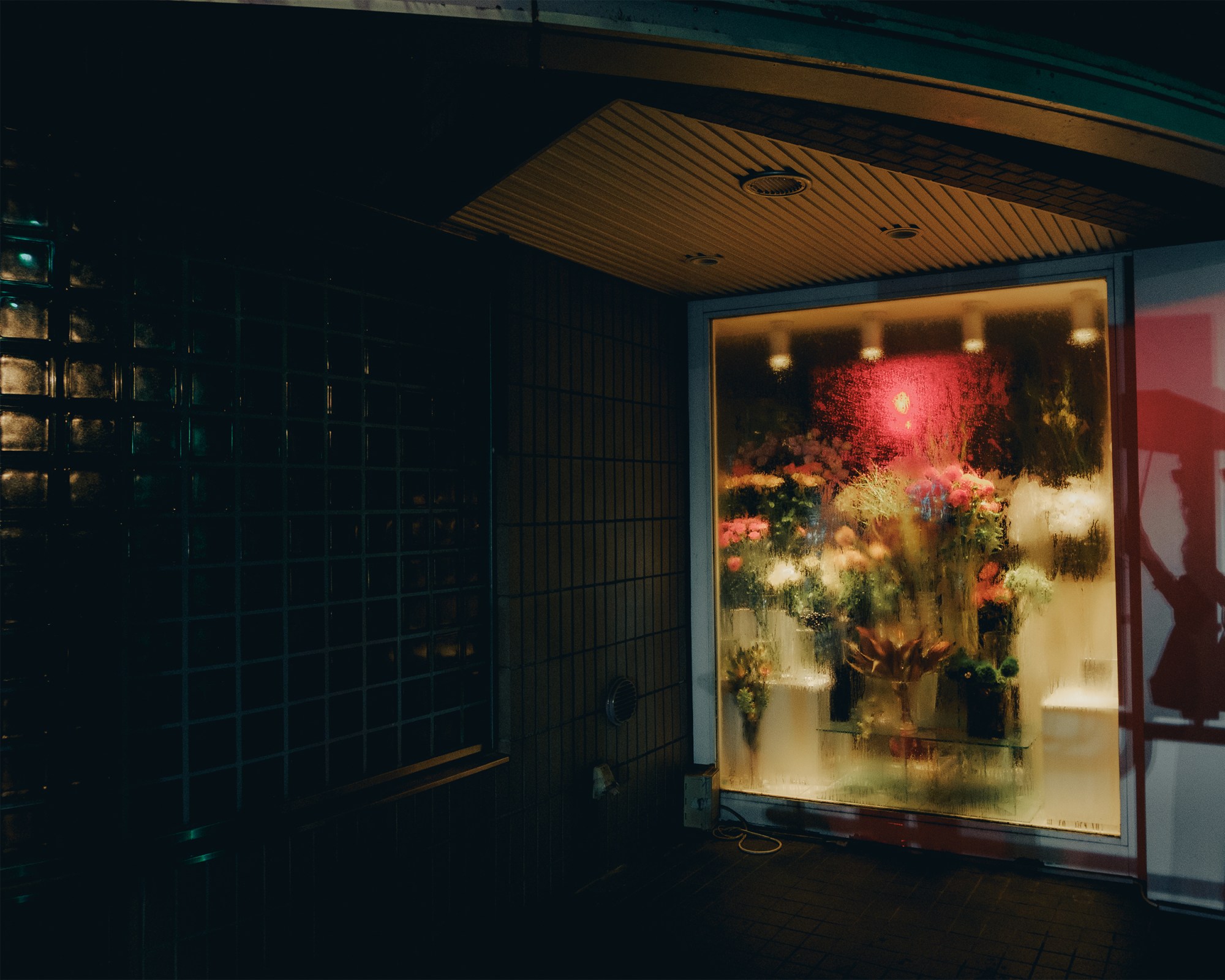 An image of flower bouquets in a shop window.